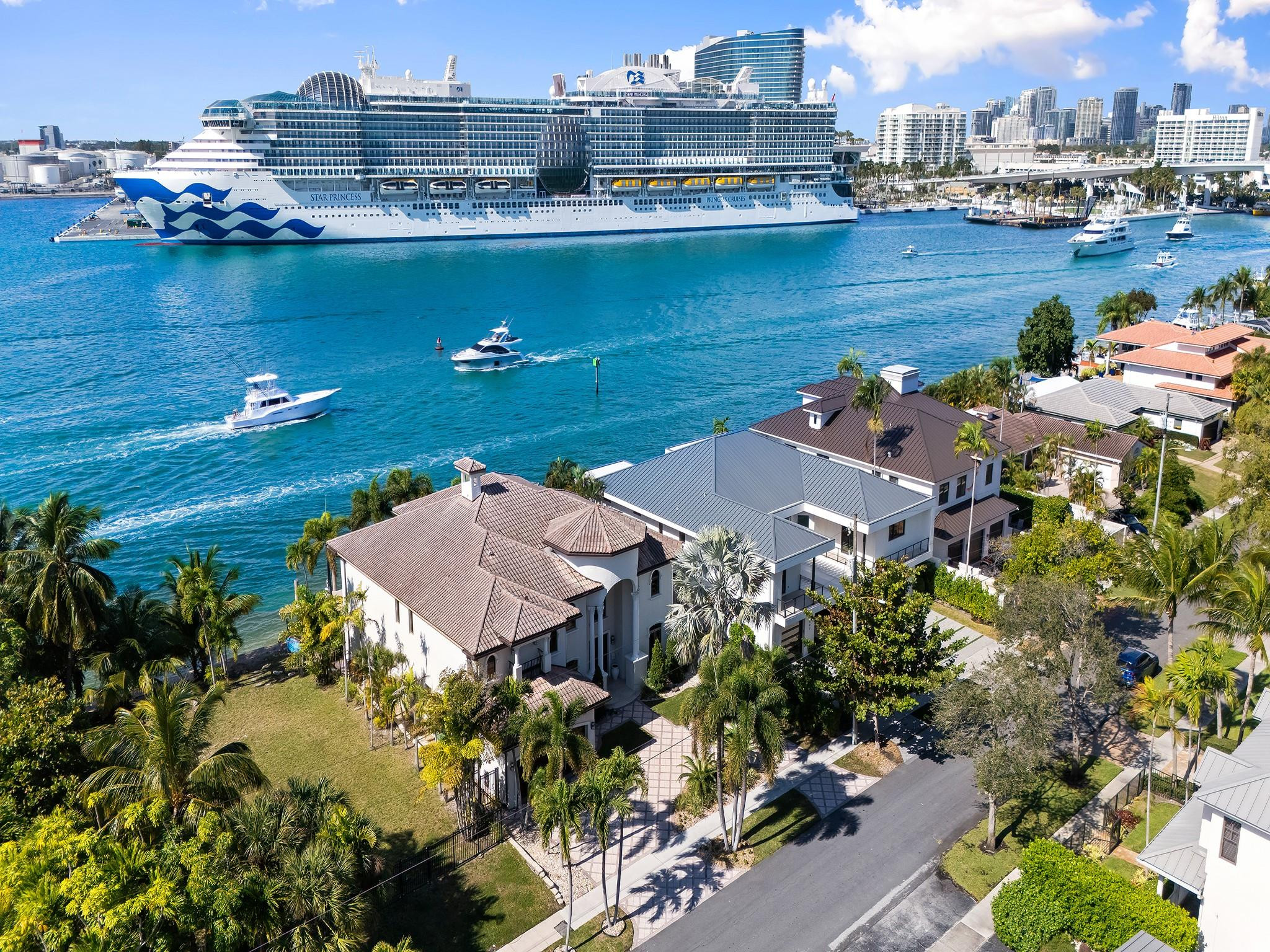 Unrivaled views over the Intracoastal waterway enhanced by a parade of yachts & cruise ships. Lifestyle & location converge in this waterfront estate defined by sophisticated design, architecture & attention to detail for those who enjoy an elevated lifestyle. Light filled interiors reveal multiple living spaces with waterway vistas, soaring ceilings & doorways that seamlessly connect to a large covered terrace, open balconies, pool, spa & an expansive patio. The chefs kitchen is perfectly appointed for those who cook & entertain & opens onto the family room. The oversized primary suite offers a private waterside balcony, home gym, sauna, steam rm, lavish bathroom & custom closet. Additional Features include an elevator, media room, wine storage, wet bar & staff quarters. Sq Ft from IMAPP.