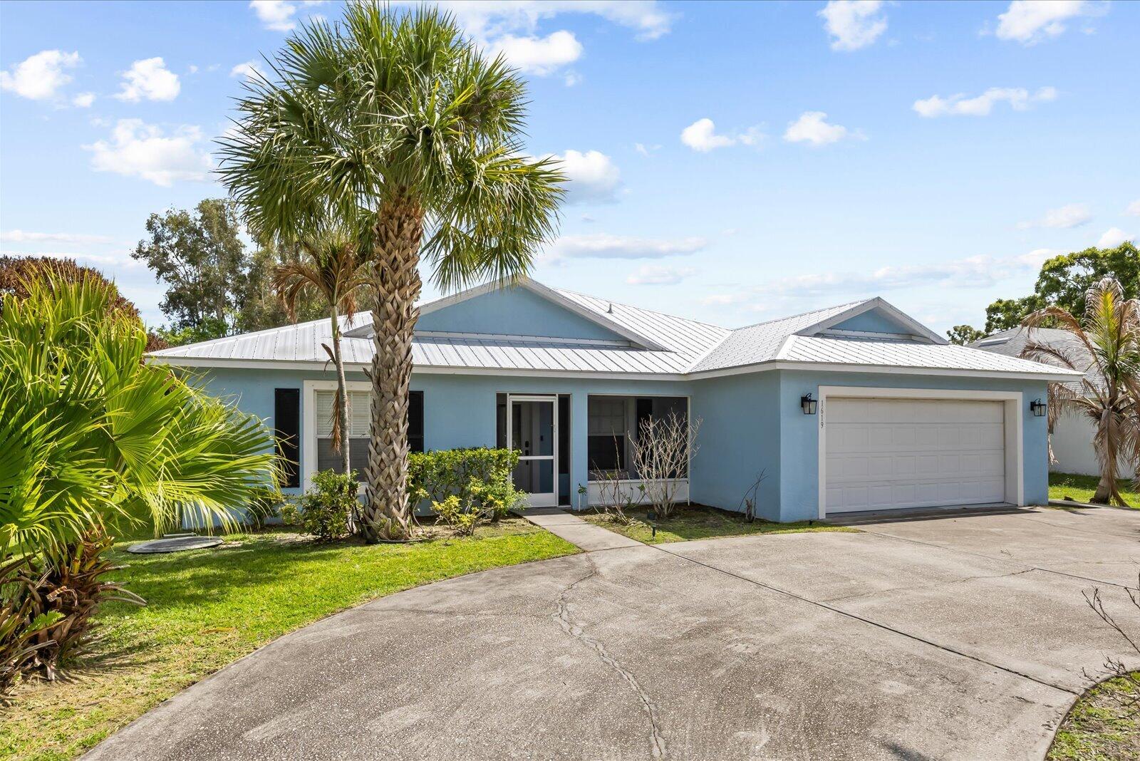 Move-in ready 4BR/3BA home with major upgrades already done! Featuring a 2023 metal roof, 2022 water heater, and updated A/C. The kitchen boasts 42" cabinets, while bedrooms offer modern vinyl plank flooring. Spacious primary suite includes dual closets and a relaxing Jacuzzi tub. Enjoy Florida living on the large lanai, plus newly finished terrazzo front porch and back patio (2024). Impact glass front door, ADT wiring, and AT&T fiber availability complete the package.