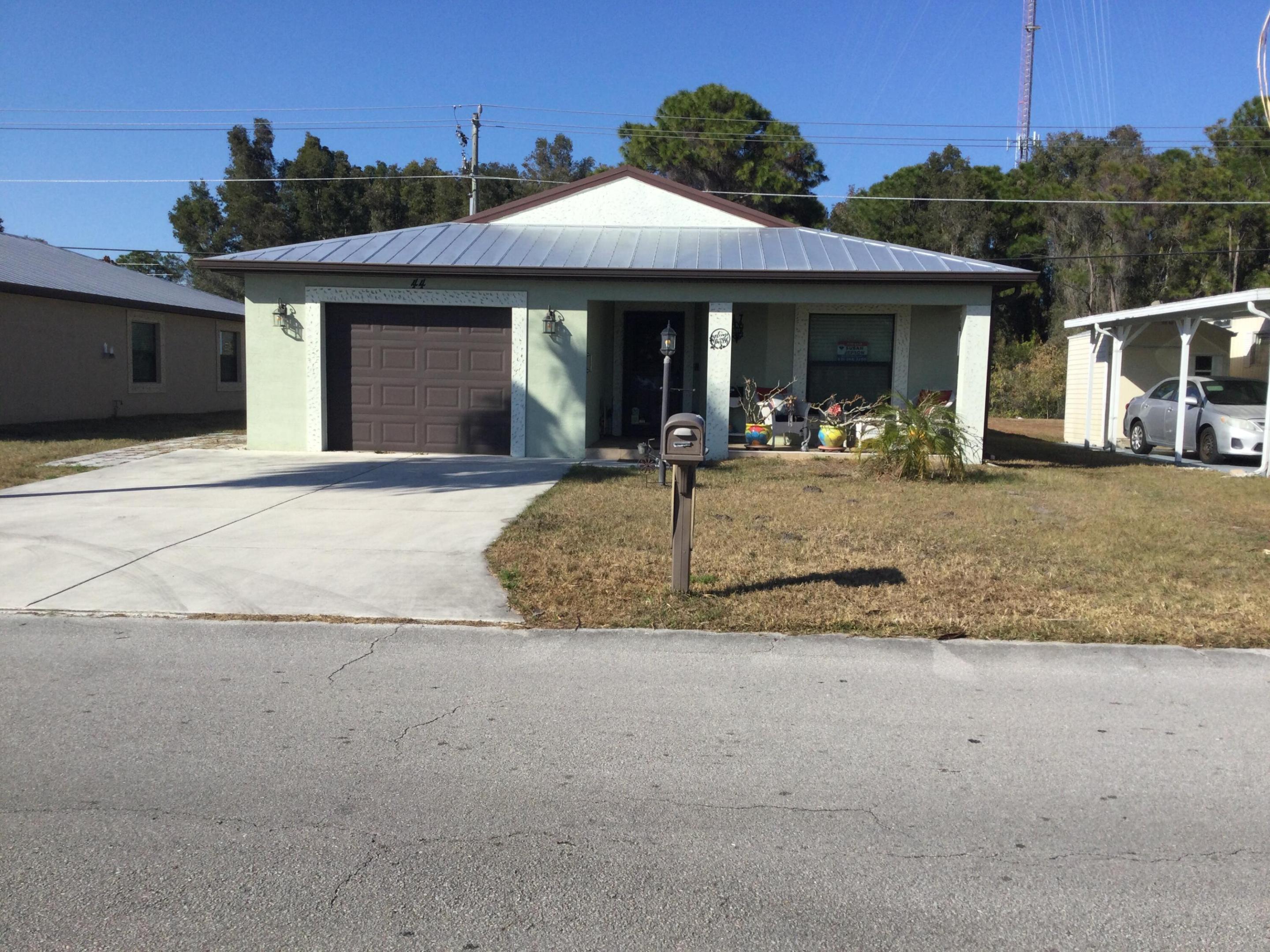 Move right into this concrete block home that backs up to the canal.  Sip your morning coffee while bird watching from your backyard patio.  This home features vinyl flooring, solar panels, enclosed back porch, hurricane impact windows, Closet by Design master bedroom closet and an office section.  This house has it all.  Why pay $100k more and wait for a new build.  No waiting... buy now and enjoy now!  Lot rent covers all amenities, trash removal and lawn care.  Amenities include golf, tennis, pickleball, shuffleboard, bocce, billiards, ping pong, two pools (one is heated), party room, game room, library, dog park and much much more.  Do as much as you like or just sit by the pool and relax.  Future residents must be approved by Spanish Lakes.  Call for application.