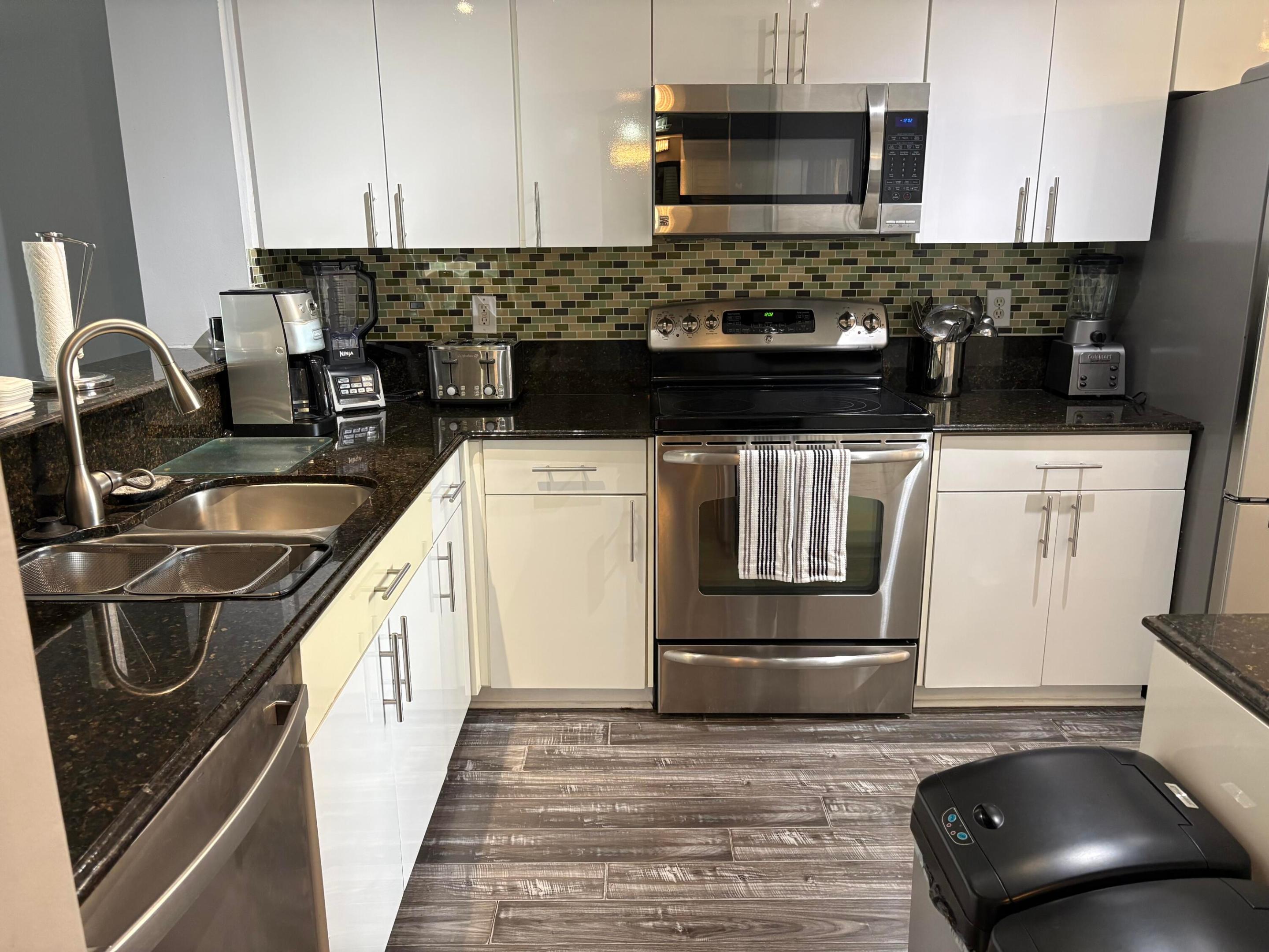 This stunning lake-view property features a 2-bedroom, 2-bathroom layout—split bedroom plan. The kitchen has been recently updated and features stainless steel appliances and upgraded cabinets. The home is equipped with a water filtration system throughout. It can be sold either furnished or unfurnished. Cable and internet services are ready for use. Conveniently located just steps away from the bus stop and pool, the property includes a designated parking space (number 49). NEW AIR CONDITIONER JUST INSTALLED FEB 2026.