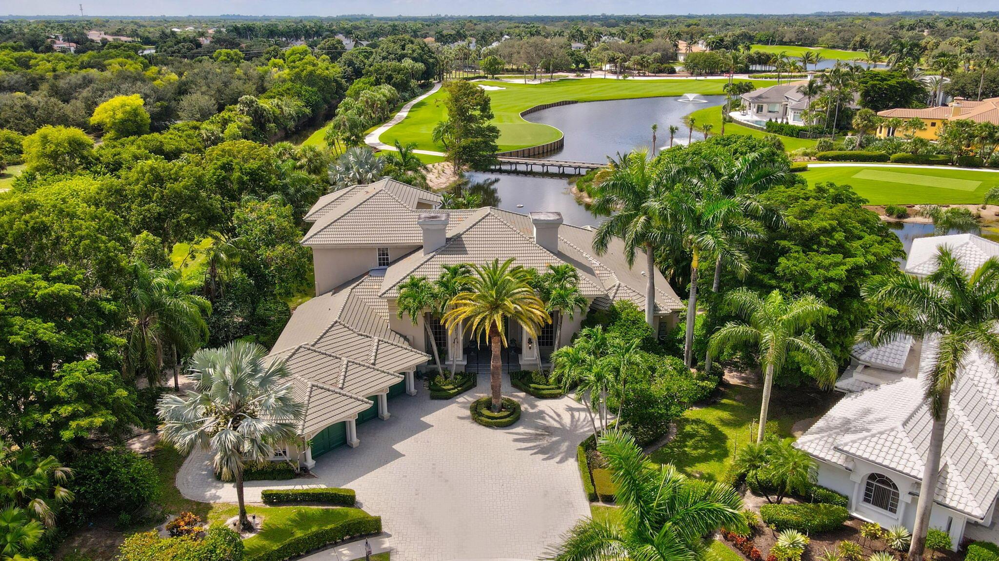 Discover the luxury and elegance of country club living at Addison Reserve, one of Delray Beach's most prestigious communities. Located on a private cul-de-sac, this expansive lot sits on over ½ an acre. The estate boasts breathtaking long lake views, overlooks the pristine golf course, and offers the utmost privacy as it neighbors the Morikami Preserve. Here is your opportunity to own an extraordinary estate in the highly coveted Brookfield Estates, which is an exclusive enclave of only 22 homes.
Step inside to this double door entry, to vaulted ceilings and an incredible layout, boasting over 6,000+sqft under air, 5 spacious bedrooms, a stately office that feels more like a private library, and a second story loft with an incredible terrace balcony, 3 car garage + golf cart entrance. Every detail of this residence has been thoughtfully crafted. The expansive backyard includes a screened in patio, pool, hot tub overlooking the fountains.
This is a once-in-a-lifetime chance to acquire a home of such caliber, location, and distinction. Don't miss this truly unique offering in Addison Reserve Country Club.
