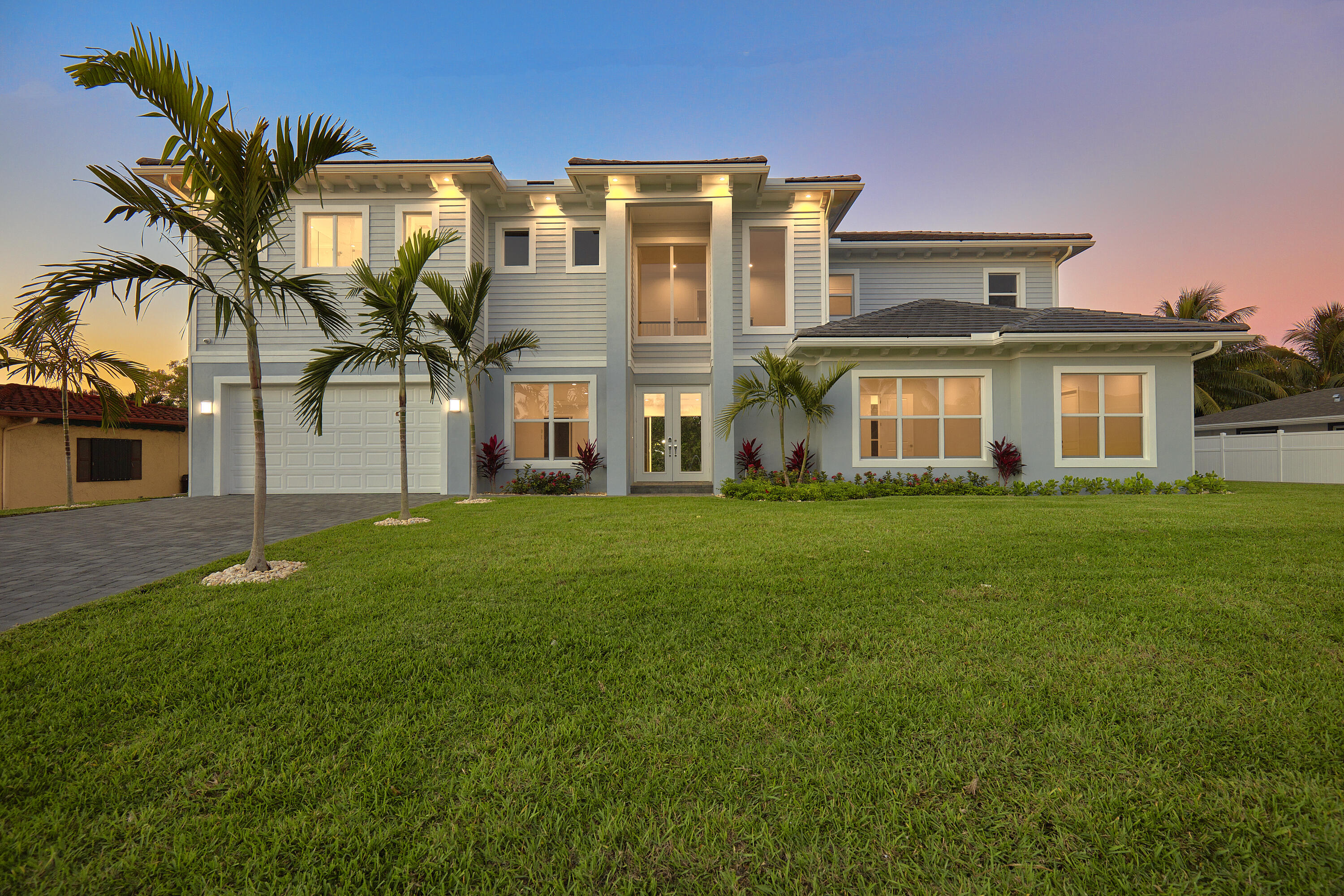 New construction only 5 years young! This beautiful waterfront home is only 3 lots to the Intracoastal Waterway with no fixed bridges to the Ocean. Meticulously maintained and outfitted to perfection by a critically acclaimed designer, the property offers plush furniture, unique lighting and graceful drapery along with plantation shutters throughout. Versatile floor plan with private elevator, first and second floor master suite options, den, flex space, open concept living and an outdoor space ideal for entertaining with views of the Intracoastal Waterway from the upper and lower levels. Bring your large boats and park right behind the house! No neighbors directly across the waterway. Elevator, 30lb boat lift and selling the home as is fully furnished. Bring your boat and your toothbrush!