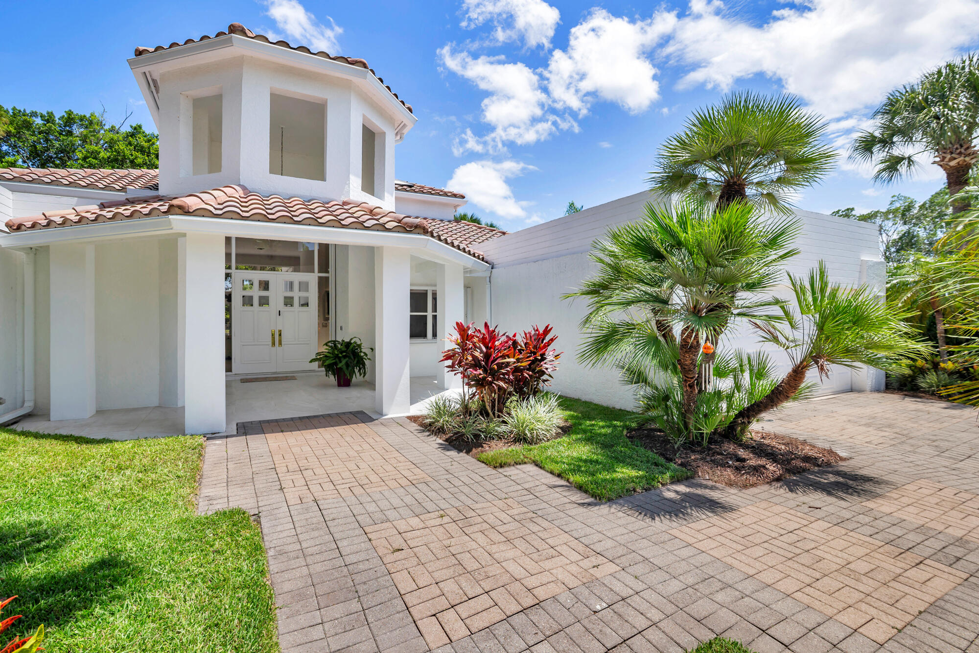 Step into a private sanctuary where modern luxury meets timeless Florida beauty. This exquisitely renovated 3bedroom, 3bath residence with a dedicated office sits at the end of a secluded culdesac, wrapped in vibrant tropical greenery that feels worlds away from everyday life. Sunlight pours through expansive windows, illuminating sophisticated finishes and seamless indooroutdoor living spaces. At the heart of the home, the chef's kitchen dazzles with premium granite surfaces, sculptural lighting, and WiFi-enabled Thermador appliances—an entertainer's dream crafted for both style and performance. Recent upgrades include porcelain tile flooring (2023), updated bathrooms (2026), irrigation system (2024), two-zone HVAC (2022), and a Rheem water heater (2022). Every detail has been elevated, from porcelain tile flooring and spainspired baths to the upgraded irrigation system and efficient twozone HVAC. Beyond the living spaces, a dramatic screened loggia opens toward the shimmering saltwater pool, framed by serene garden and sweeping golfcourse views. It's a private escape designed for unforgettable gatherings and quiet moments alike. All within a secure, manned gated community, Breakers West offering optional membership to distinguished Breakers West, Mayacoo Lakes country clubs, and just minutes from the cultural, equestrian, and coastal attractions of West Palm Beach and Wellington. Enjoy the Florida lifestyle from the large screened loggia overlooking the saltwater pool with serene garden and golf course views of Mayacoo Lakes. A rare opportunity to own a move-in-ready home combining modern luxury, privacy, and exceptional outdoor living.  24 hr manned gate with roving security patrol. Non mandatory memberships available at Breakers West, Breakers Palm Beach and Mayacoo Lakes country clubs. 15 min to downtown WPB and Wellington polo grounds. 10 min to airport