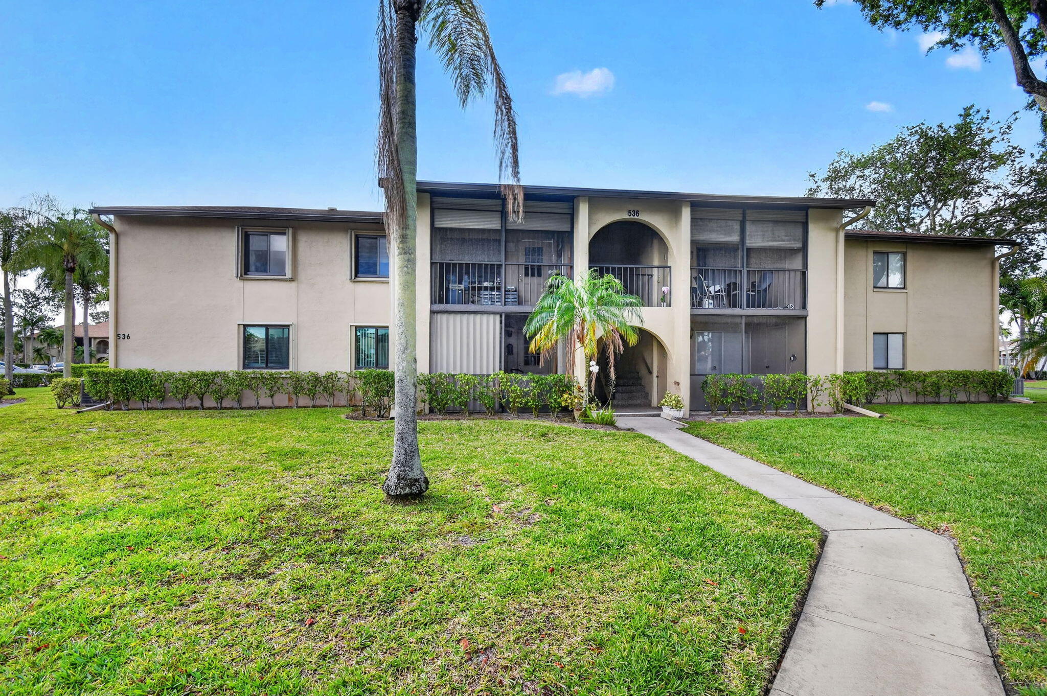 Great location, in excellent run community, manicured gardens, this 2 bed 2 bath is just steps from the community pool and clubhouse, it is on the second floor with a court/balcony entrance, it feels very cosy, nice wall accents, remodeled kitchen, nice tile and laminate wood floors throughout, nice large living room dining and kitchen area. Large master bedroom with built in closets, new hurricane windows, A/C is 2022, also accordion shutters, laundry room with full size washer and dryer. Brand new roof. Large attic space.