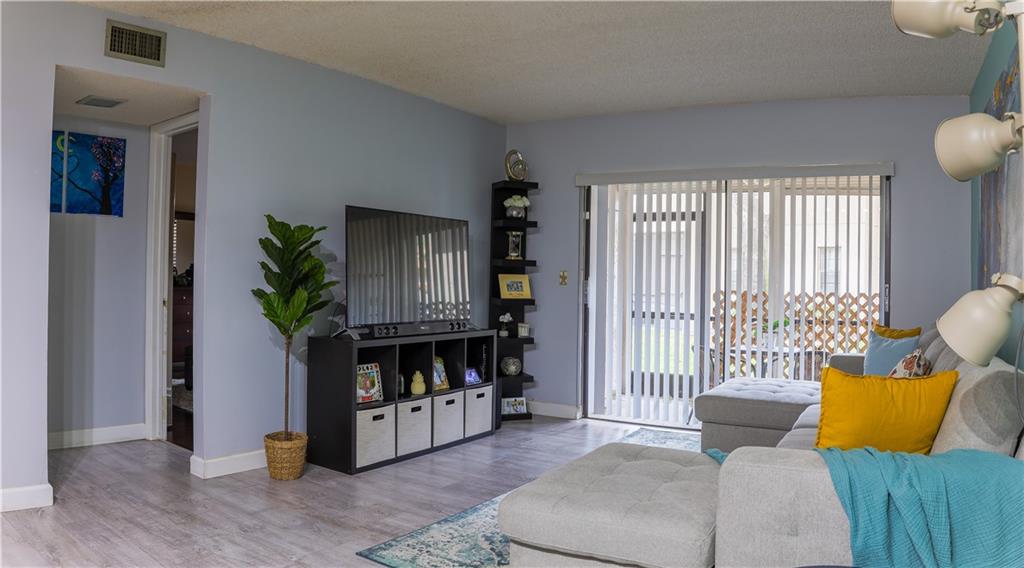 BEAUTIFULLY RENOVATED 2 BEDROOM 2 BATHROOM CONDO. Spacious Patio and Porch located at front and back of property with a dedicated storage room. Updated kitchen, Floors and bathrooms. Washer/Dryer in unit. MUST SEE! Right next to Cypress Creek Trail which is large walking/biking trail that spans from the Everglades to the ocean. Maintenance includes water/trash, insurance, roofs, building exterior and lawn care. Close to shopping and dining.
