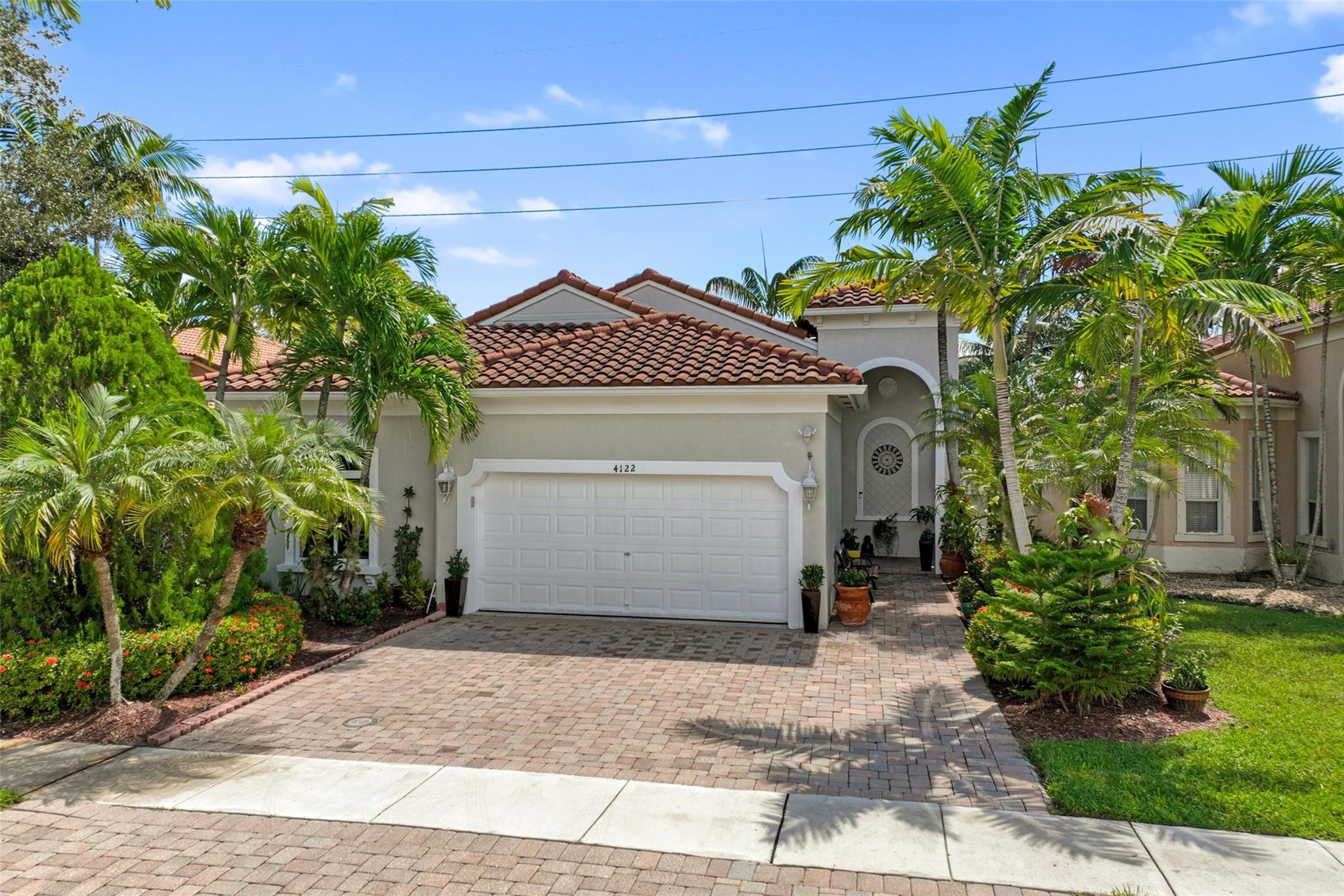 *PRICE REDUCED!!! 3/2 single-family home in gated Portafolio Estates! Features 2-car garage + 3 driveway spaces, new roof (2022), new A/C (2024), impact windows and exterior doors, crown molding, recessed lighting, zebra blinds and fully remodeled open kitchen. Split layout, tile flooring throughout, freshly painted exterior, new gutters, covered patio w/pavers, sensor exterior lights, and new vinyl fence. Appliances updated (2021-2025), including new washer, dryer & fridge (2025). Quiet garage opener, fans w/remotes. Impeccably maintained and move-in ready. Prime location near highways, schools, and shopping. These items don't convey with the house & will be retained by Seller: plants and orchideas, TV locate at the patio, Drapes & curtain brackets in bedrooms, refrigerator at the garage.