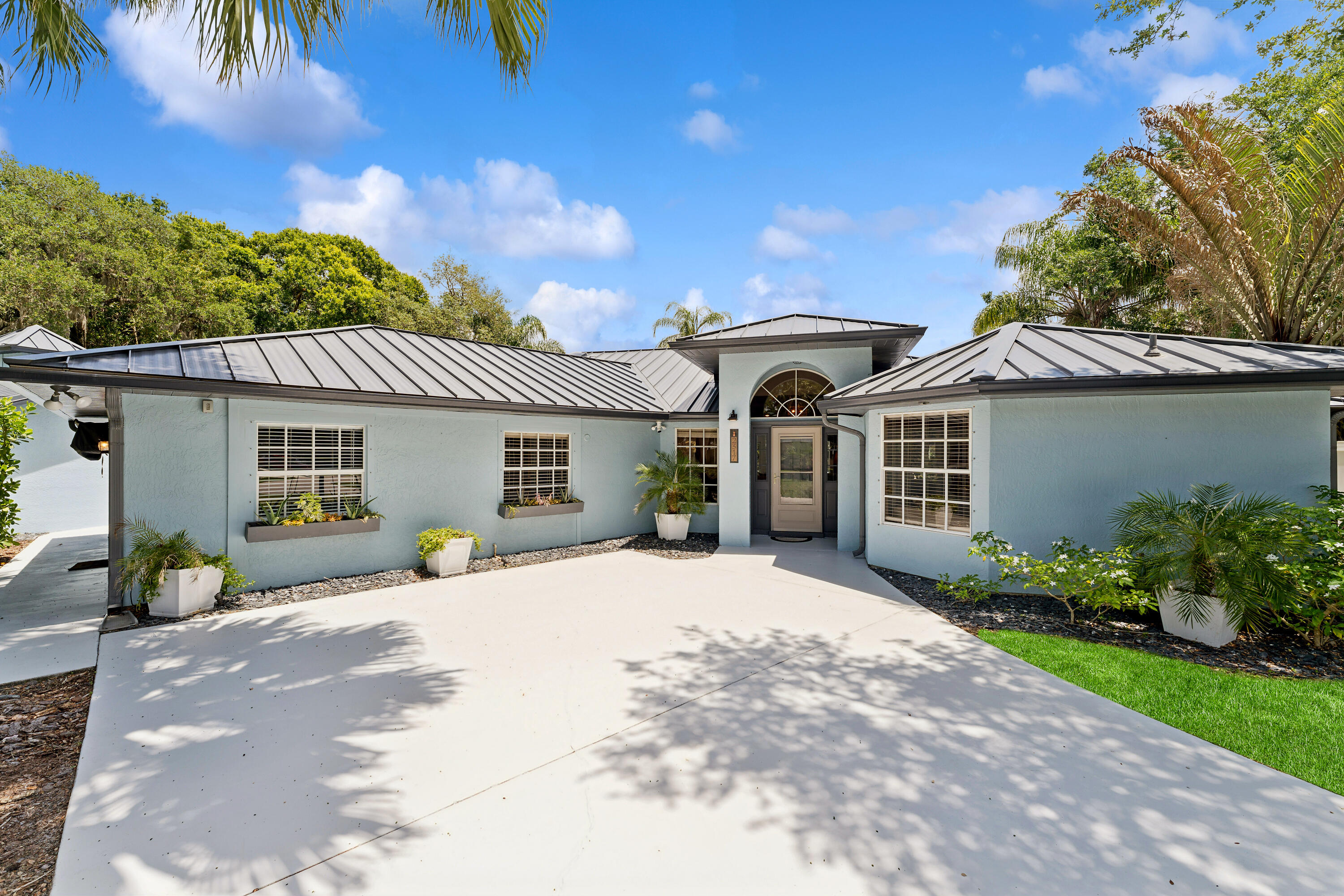 Welcome to this beautifully updated 4-bedroom, 3-bathroom home situated on an oversized half-acre corner lot offering space, flexibility, and income potential all in one. This property features a thoughtfully designed layout including a dedicated nursery room, making it perfect for growing families. The dining area is enhanced with a stylish barn door, allowing the space to be easily transformed into a formal dining room, private home office, or even a gym. The home has been tastefully upgraded with a brand-new metal roof, a modernized kitchen, and fully updated bathrooms, giving you peace of mind and move-in-ready convenience. Step outside to your private backyard oasis, complete with an in-ground saltwater pool that was resurfaced in October 2025.