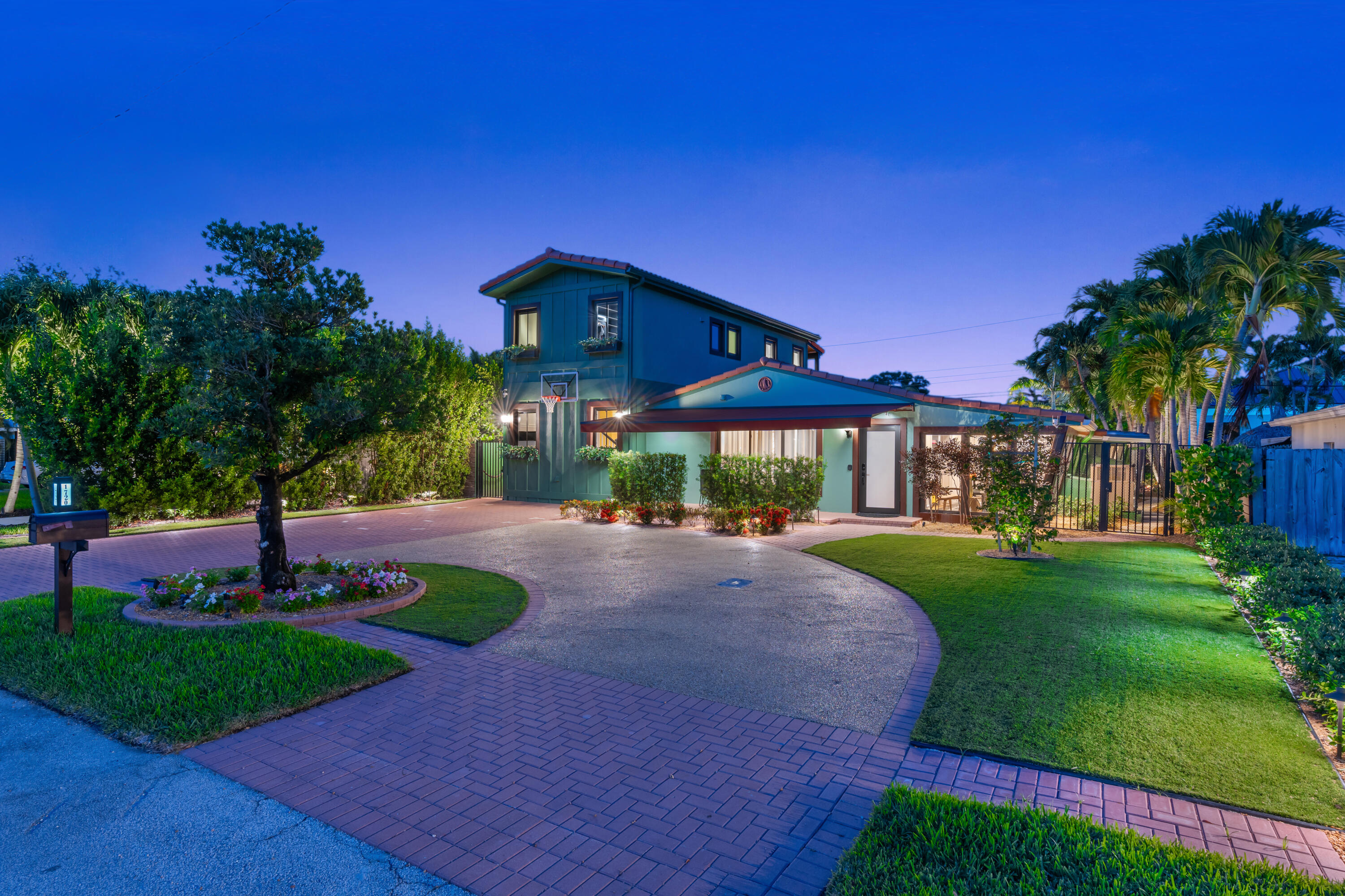 A private resort in the heart of Poinsettia Heights, offered fully furnished with professionally curated furnishings throughout. Created by a builder-owner, this fully reimagined residence reflects a level of planning, functionality, and craftsmanship rarely found. Featuring a heated pool with custom water features, golf chipping and putting green, private mini farmette, curated landscape lighting, and an indoor summer kitchen with pass-through bar to the pool, this home is designed for exceptional entertaining and effortless indoor-outdoor living. The chef's kitchen features JennAir and Sub-Zero appliances, while the second-floor primary suite offers a private balcony and spa-inspired bath. Just 2.5 miles from Fort Lauderdale Beach. An unmatched property—no expense spared. At the center of the experience, the indoor summer kitchen is fully equipped with premium appliances including a Miele charcoal grill, Miele teppanyaki, and Miele deep fryer, along with beverage and wine refrigeration, a Fisher & Paykel drawer dishwasher, and a pass-through serving window to the poolside bar—creating a seamless flow for cooking, serving, and entertaining without interruption. The main chef's kitchen features a JennAir 6-burner gas range with double ovens and griddle, 6-foot Sub-Zero refrigerator and freezer columns, slide-drawer undercounter microwave, double-faucet 48" sink, custom pantry with automatic lighting, food dispensers, a signature automatic fruit juice fountain, and sparkling water dispenser.  Interior finishes include true hardwood floors throughout, high-end wall treatments and custom wainscoting, custom interior doors, designer lighting, power window treatments, and a Lutron lighting control system offering multiple custom lighting scenes throughout the home and grounds. A whole-house CAT5 network with hardwired internet connections, WiFi hubs throughout for seamless coverage, and a fully networked home office provide connectivity designed for modern living.  The second-floor primary suite is a true private retreat, featuring its own private balcony, a spa-inspired bath with a 72-inch two-person champagne bubbler tub, dual walk-in shower, designer plumbing fixtures, dual vanities, custom walk-in closet with automatic lighting, built-in coffee station, undercounter refrigerator, microwave, and personal dry-cleaning unit.  Outdoor amenities include a heated pool with custom water features, power retractable awning, custom landscape lighting, golf chipping and putting green, shaded yoga garden, private mini farmette, mature citrus trees including orange, grapefruit, and lemon, brand-new landscaping, irrigation and landscape lighting, a seedling station with micro-irrigated garden planters, custom pet apartment, storage building with loft, triple-filtered whole-house water filtration system, tankless gas water heater, full-size second-floor gas washer and dryer, and multiple lighting themes designed to transform the property from a private retreat to an entertainer's paradise.