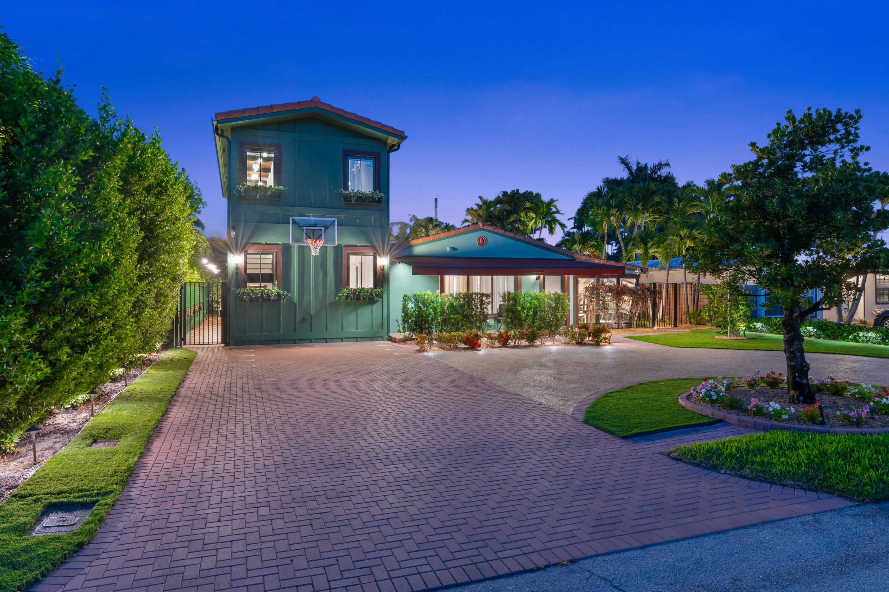 A private resort in the heart of Poinsettia Heights, offered fully furnished with professionally curated furnishings throughout. Created by a builder-owner, this fully reimagined residence reflects a level of planning, functionality, and craftsmanship rarely found. Featuring a heated pool with custom water features, golf chipping and putting green, private mini farmette, curated landscape lighting, and an indoor summer kitchen with pass-through bar to the pool, this home is designed for exceptional entertaining and effortless indoor-outdoor living. The chef's kitchen features JennAir and Sub-Zero appliances, while the second-floor primary suite offers a private balcony and spa-inspired bath. Just 2.5 miles from Fort Lauderdale Beach. An unmatched property—no expense spared. At the center of the experience, the indoor summer kitchen is fully equipped with premium appliances including a Miele charcoal grill, Miele teppanyaki, and Miele deep fryer, along with beverage and wine refrigeration, a Fisher & Paykel drawer dishwasher, and a pass-through serving window to the poolside bar—creating a seamless flow for cooking, serving, and entertaining without interruption.  The main chef's kitchen features a JennAir 6-burner gas range with double ovens and griddle, 6-foot Sub-Zero refrigerator and freezer columns, slide-drawer undercounter microwave, double-faucet 48-inch sink, custom pantry with automatic lighting and food dispensers, a signature automatic fruit juice fountain, and sparkling water dispenser.  Interior finishes include true hardwood floors throughout, high-end wall treatments and custom wainscoting, custom interior doors, designer lighting, power window treatments, and a Lutron lighting control system offering multiple custom lighting scenes throughout the home and grounds. A whole-house CAT5 network with hardwired internet connections, WiFi hubs throughout for seamless coverage, and a fully networked home office ensure every aspect of work, entertainment, and daily life operates effortlessly.  The second-floor primary suite is a true private retreat, featuring a private balcony, spa-inspired bath with a 72-inch two-person champagne bubbler tub, dual walk-in shower, designer plumbing fixtures, dual vanities, custom walk-in closet with automatic lighting, built-in coffee station, undercounter refrigerator, microwave, personal dry-cleaning unit, and full-size gas washer and dryer.  Additional property enhancements include a custom pet apartment, triple-filtered whole-house water filtration system, tankless gas water heater, and extensive updates throughout the property, with major systems already addressed and nothing left to do but move in and enjoy.  Outdoor amenities include a heated pool with custom water features, power retractable awning, golf chipping and putting green, shaded yoga garden, private mini farmette, mature citrus trees including orange, grapefruit, and lemon, brand-new landscaping, custom irrigation system, designer landscape lighting, a seedling station with micro-irrigated garden planters, storage building with loft, and multiple outdoor living spaces designed to transition effortlessly from a peaceful private retreat to an exceptional entertaining environment.  Designed for those who appreciate exceptional living, effortless entertaining, and uncompromising attention to detail, this one-of-a-kind residence must be experienced in person to be fully appreciated.