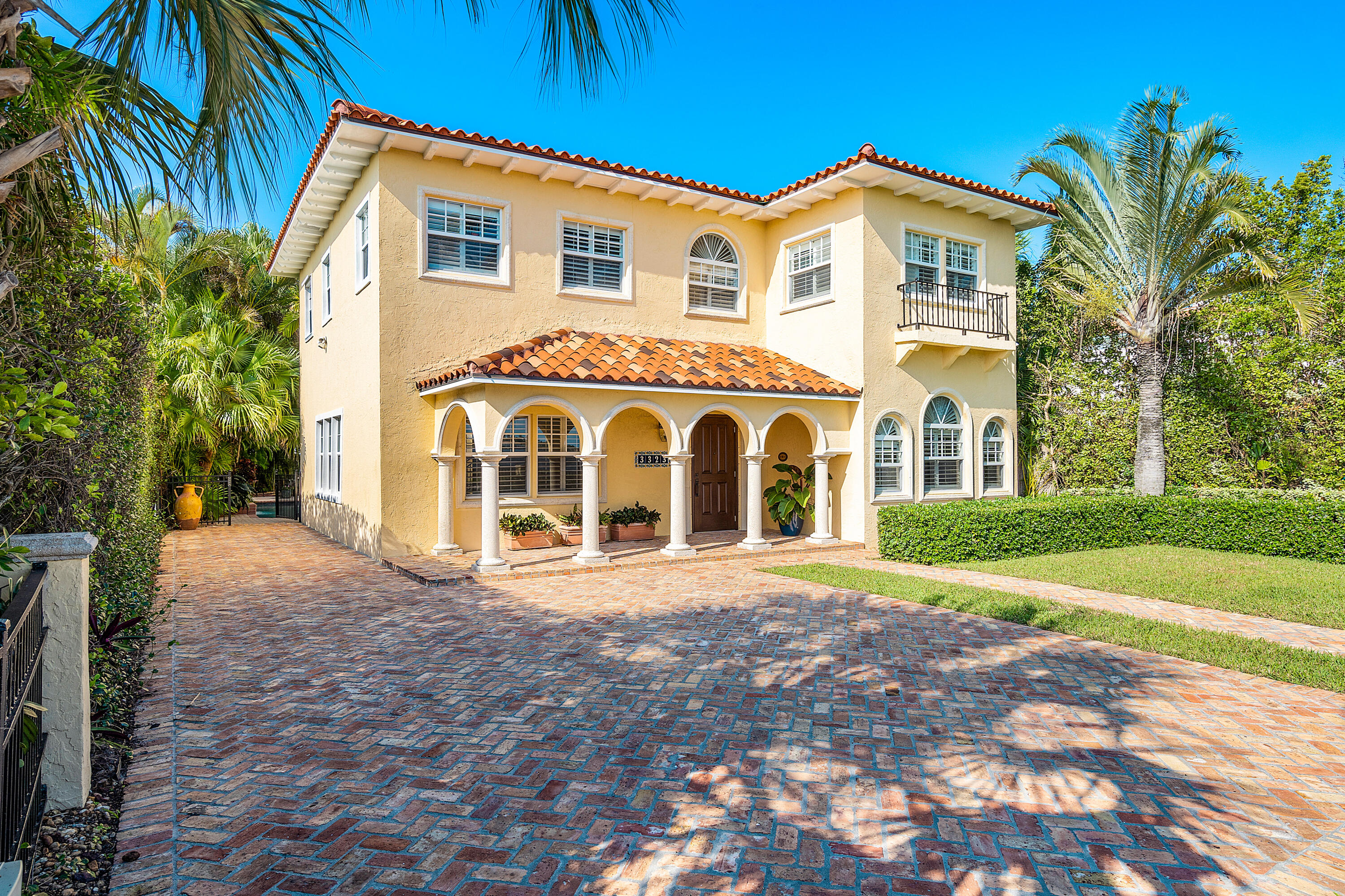 Gracious Direct Intracoastal home with a new dock looking across the water way at the mansions of the estate section of Palm Beach. A 1928 gem renovated for 21st century living. Magnificent original tiled staircase with a wrought iron bannister, patterned stoned and wood floor, 10ft ceilings, a tiled fireplace, and many authentic architectural details throughout. A new front porch was added to the main house along with a Chicago brick driveway and electric gates. All hurricane impact windows and doors, new kitchen and pantry, new master bath, and new walk-in closets. The guest house includes a rebuilt staircase, spacious downstairs living room with new bath, and upstairs full kitchen, bath and bedroom. Private tropical landscaped pool plus a separate storage room.