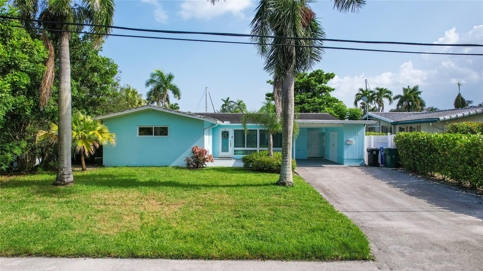 Beautiful 3/2 waterfront property on the North Fork canal with no fixed bridges to the ocean. Canal is deepwater, and dock includes a boatlift. Large screened-in patio is great for entertaining day & night. Great location just off of I-95 and Broward Blvd. Bathrooms, kitchen and plumbing has been beautifully remodeled. Vinyl impact windows throughout the home, and solid exterior make this home a safe and sound structure. Great location in a beautiful neighborhood! *Furnished pricing option available*