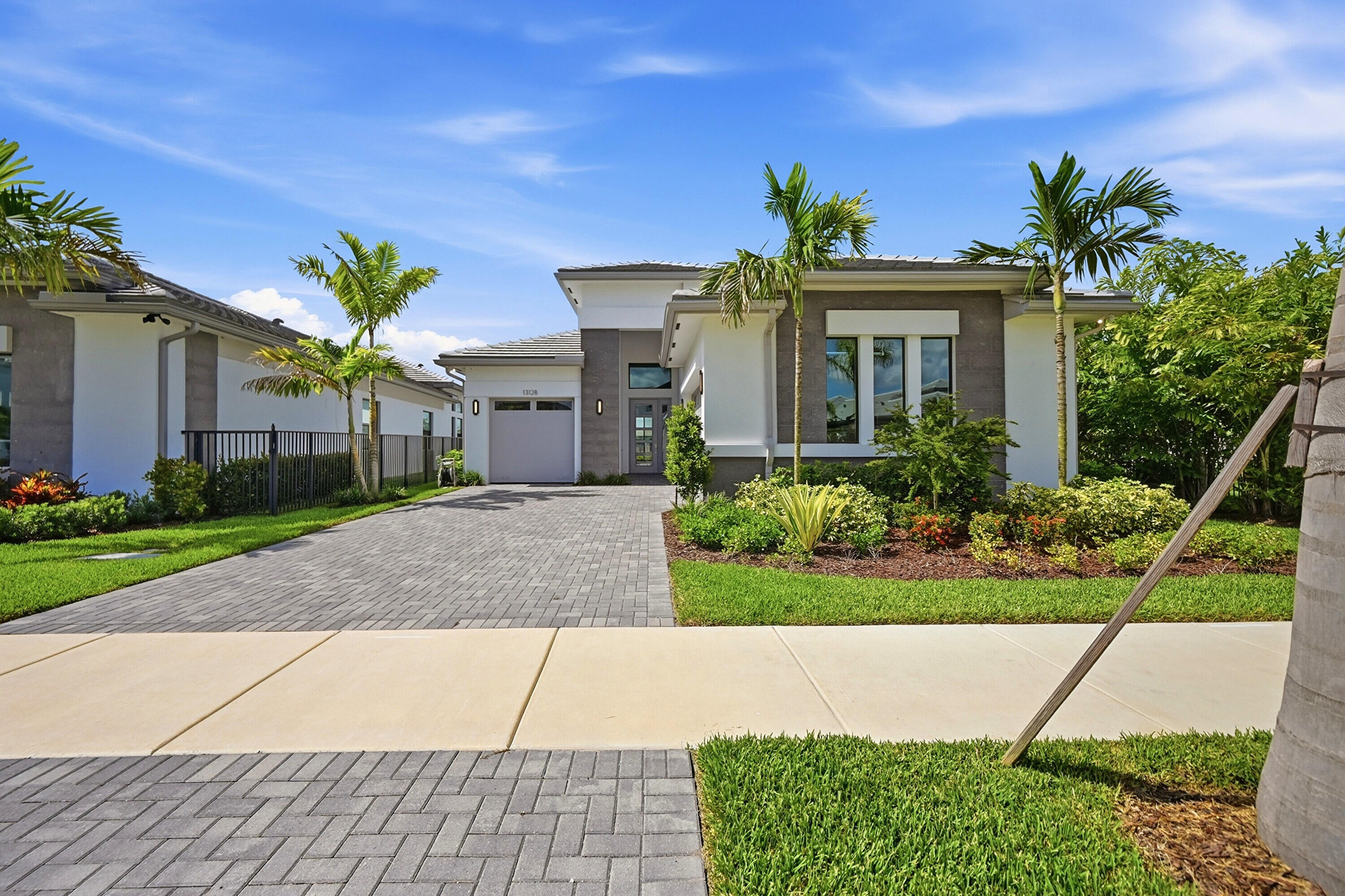 Stunning Calypso model with 3 beds + den, 3.5 bath and a rare 3-car garage! Soaring volume ceilings create an airy, open feel throughout. The spacious master suite features luxurious walk-in closets and a spa-like bath with a floating tub. Enjoy a beautifully designed layout perfect for living and entertaining. Step outside to a gorgeous backyard with serene lake and fountain views. A rare rental opportunity in prime Apex location! Located within the highly sought-after Apex at Avenir community in Palm Beach Gardens, residents enjoy access to world-class amenities, modern clubhouse facilities, fitness center, resort-style pool, tennis and pickleball courts, walking trails, and a prime location close to championship golf, fine dining, shopping, beaches, and top-rated schools.