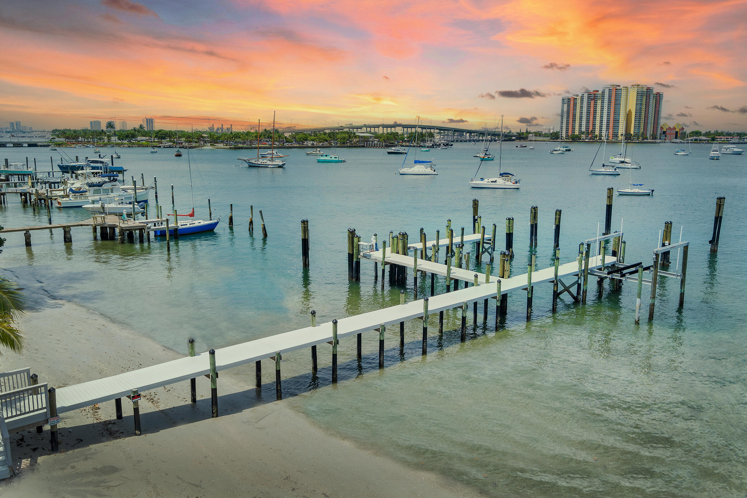 Unmatched Waterfront Estate Opportunity on Singer Island. Welcome to the largest waterfront lot on Singer Island north of the bridge—a truly rare offering boasting 159 feet of direct Intracoastal frontage and breathtaking panoramic wide-water views. The main house has been taken down to the studs and is ready to be reimagined—plans available. Set on 3/4 of an acre, this private estate epitomizes the pinnacle of South Florida coastal living, just minutes from the Palm Beach Inlet and within walking distance to pristine beaches.

Tailored for serious boating enthusiasts, the property features a new seawall and dock, four oversized boat slips—including accommodations for large yachts—24,000 lb Hurricane Boat Lift, 480V 3 Phase power, and water. The expansive grounds include a private sandy beach and a sprawling yard perfect for entertaining. A to-be-completed resort-style pool with a 4-ft deep lazy river promises the ultimate in outdoor leisure.

Additional highlights include a separate renovated 3-car garage and a new 2-car garageideal for a car collection, storage, or workshop spaceand a fully renovated detached 2-bedroom, 2-bath guest house complete with full kitchen and living area, offering exceptional accommodations for guests or extended family.

Whether you choose to renovate the existing structures or build your dream waterfront mansion, this property presents a rare, one-of-a-kind canvas for luxury living. Bring all your water toys and enjoy immediate access to world-class boating, fishing, and beaches. Don't miss this extraordinary opportunity to own one of the most coveted waterfront estates in Palm Beach County.