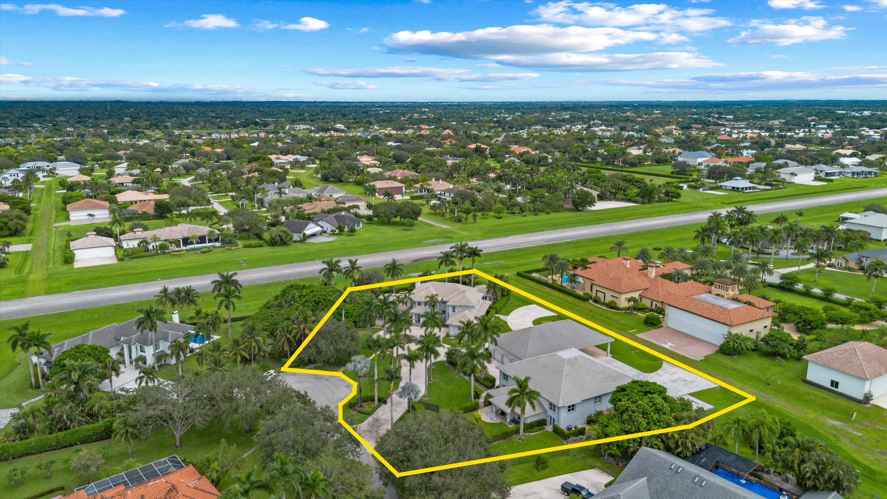 Welcome to Aero Club, an exclusive aviation community boasting its own private runway. This custom-built residence features four bedrooms and six baths (five full and one half), spanning approximately 6,935 sq ft of luxurious living space. Perfectly designed for pilot comfort and entertaining, it sits on the only Runway double-lot (2.05 acres) available for sale  and is ready for you to move in.

Step outside to discover the pool and inviting beach seating area, a cozy gas fire pit, spa, and sauna. The outdoor living space is enhanced by a climate controlled panoramic view summer kitchen, loaded with high-end BBQ and kitchen appliances, plus a dining area by the pool for effortless al fresco entertaining.

Inside, you'll find a remodeled kitchen (more) Welcome to Aero Club, an exclusive aviation community boasting its own private runway. This custom-built residence features four bedrooms and seven baths (four full and three half), spanning approximately 6,935 sq ft of luxurious living space. Perfectly designed for pilot comfort and entertaining, it sits on the only double-lot airstrip available for sale (2.05 acres) and is ready for you to move in.

Step outside to discover a new pool and inviting beach seating area, a cozy gas fire pit, spa, and sauna. The outdoor living space is enhanced by a climate-controlled panoramic-view summer kitchen, loaded with high-end BBQ and kitchen appliances, plus a dining area by the pool for effortless al fresco entertaining.

Inside, you'll find a remodeled kitchen featuring double refrigerators and freezers, an induction cooktop, and a range hood ideal for culinary enthusiasts. For wine lovers, a sophisticated wine cellar adds an elegant touch to gatherings. Enjoy movie nights in the state-of-the-art home theater, designed for an immersive viewing experience.

The property also includes two additional structures:
A spacious modern hangar (73' x 69'; 5,037 sq ft) fully air-conditioned and finished with polished concrete epoxy floors, capable of accommodating multiple aircraft, including the largest jet allowed in the Aero Club. Attached to the hangar is a 1-bedroom, 1-bath guest house with a full kitchen and living area perfect for pilots or visitors.
Outside the hangar, a large concrete ramp and a helipad lead to a third structure: a 51' x 53' Hangar Port. Envision parking your airplane under this hangar port and walking into a 2,120 sq ft under-air space housing an athlete's gym, a conference room and executive office with a half bath, and a 4-car collector's garage.

This estate blends luxury, functionality, and endless possibilities. Don't miss the opportunity to own this remarkable property. Schedule a viewing today!.