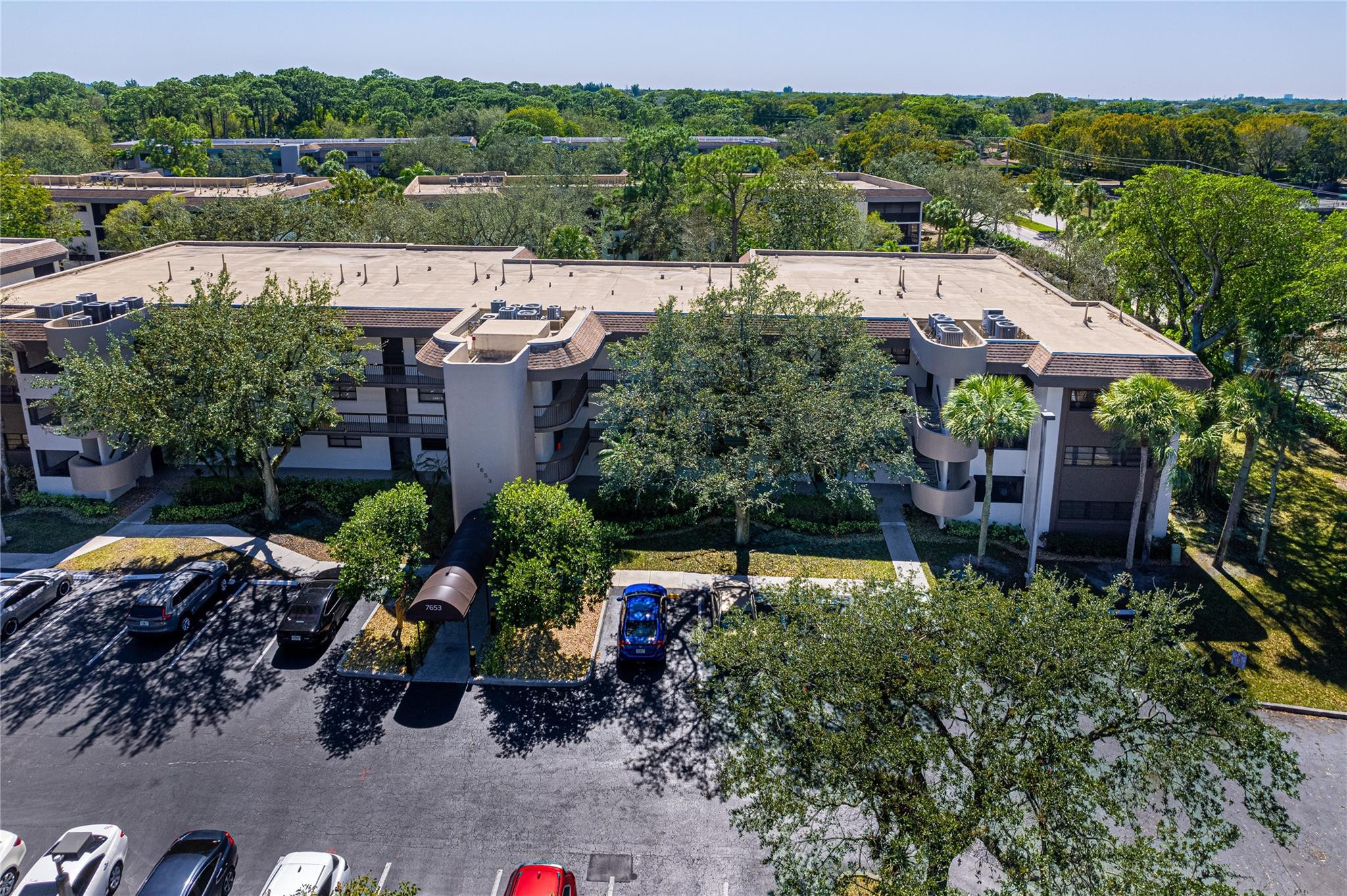 This expansive 2-bedroom, 2-bath residence offers nearly 1,500 square feet of updated living space-one of the best price-per-square-foot values in Broward County. Ideally located on the first floor, the home provides effortless accessibility & direct access to the pool and spa area just outside your back door. The spacious primary suite features two walk-in closets and a dedicated dressing area, creating both comfort and functionality. Recent upgrades include a new A/C system & water heater for added peace of mind. Cable & Internet included in fees. Located in Bonaire at Woodmont, a 24/7 gated community, residents enjoy a tranquil setting with well maintained grounds & two community pools. The peaceful atmosphere is complemented by nearby golf course & country club access just steps away.