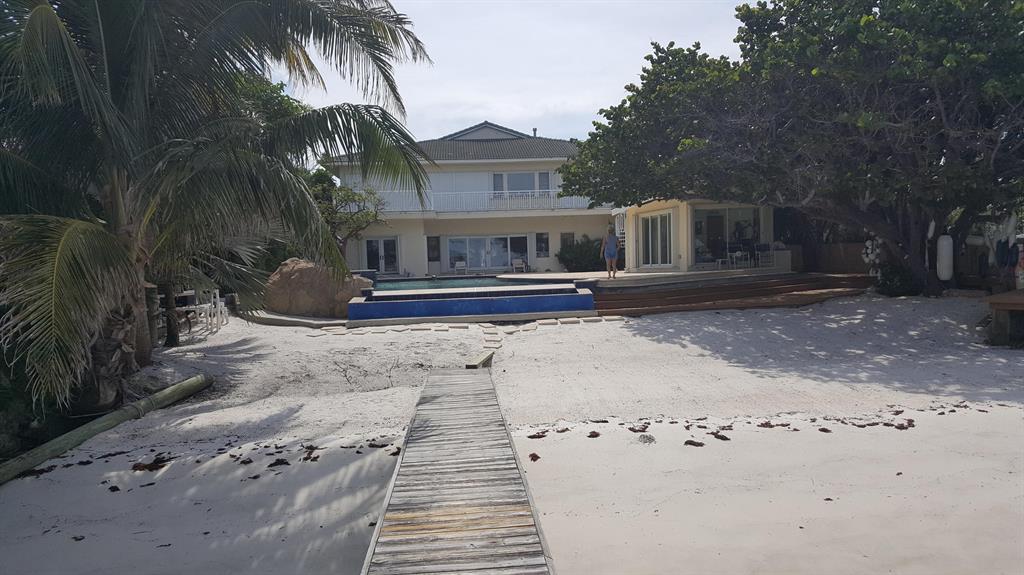 This is an incredible custom home constructed from an existing 1955 CBS home with extensive remodeling in 1997. This amazing home with sandy beach into the intracoastal and dock is impossible to duplicate and must be visited. Totally private, sitting on an acre. a separate rental house on the property pays the real estate taxes and there is a back up generator.