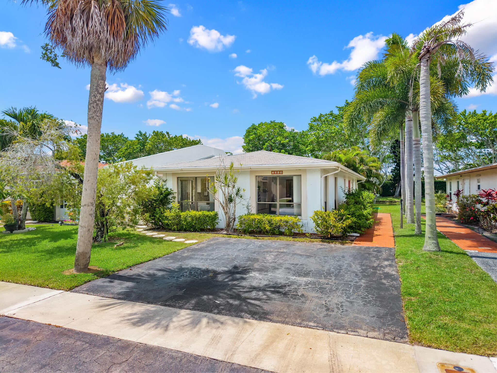 Enjoy easy Florida living in this move-in-ready waterfront villa offering the comfort and feel of a single-family home without the maintenance. This spacious 2-bedroom, 2-bath home features an inviting floor plan with a large living area, a bright Florida Room overlooking the water, and a generously sized kitchen complete with a cozy breakfast nook. Step outside to your private courtyard, the perfect spot for gardening, relaxing with your morning coffee, or entertaining guests with a backyard barbecue. The peaceful waterfront setting creates a tranquil backdrop for everyday living. Located in a welcoming all-ages community with low HOA fees and resort-style amenities, residents enjoy a quiet neighborhood atmosphere while remaining close to everything South Florida has to offer.  Conveniently situated near the Florida Turnpike, major roadways, shopping, dining, schools, Palm Beach State College, medical facilities, hospitals, and just minutes from area beaches.  Whether you're looking for a primary residence, seasonal retreat, or low-maintenance lifestyle, this waterfront villa delivers exceptional value in an unbeatable location with easy access to West Palm Beach, Wellington, Boynton Beach, Delray Beach, and Boca Raton.