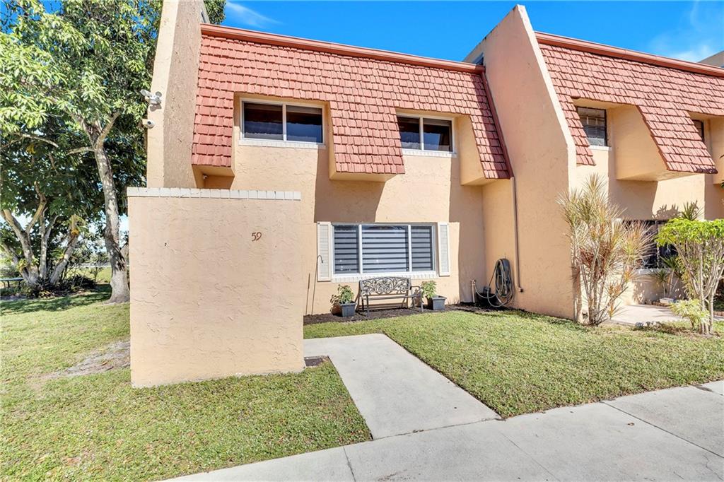 Totally upgraded 3 bed 2.5 bath corner townhome featuring wood laminate flooring throughout, a bonus room downstairs great for a den or office, an upgraded kitchen, upgraded bathrooms, new ac in 2018, impact windows in 2021, new electrical panel in 2022, a large private balcony off the main bedroom and a large screened patio downstairs both overlooking the water. Shaker Village has a community pool, basketball and handball courts. The maintenance fee includes the roof.