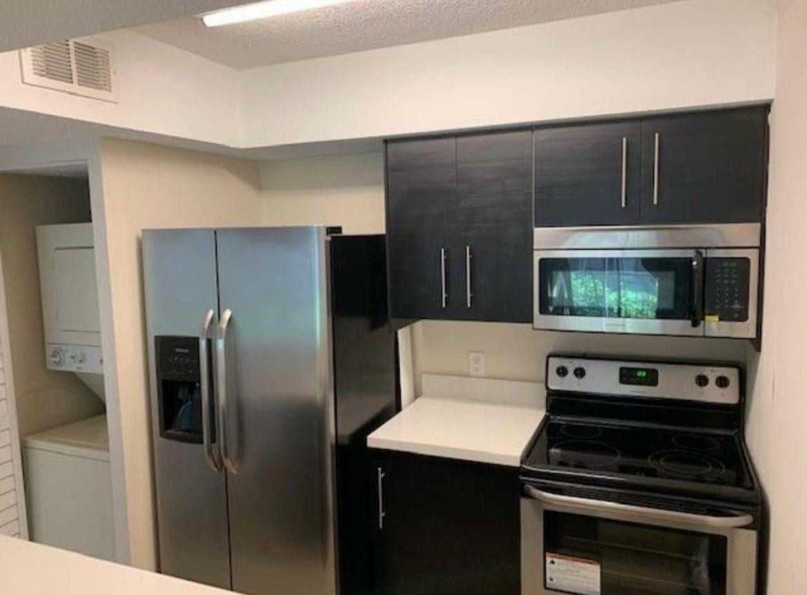 PRICED TO SELL!!!!IDEAL FOR INVESTORS OR PRIMARY HOME OWNERS!! Property Stunning 1-bedroom, 1-bathroom condo featuring convenient in-unit washer and dryer, along with a cozy balcony. Enjoy the comfort of tiled floors throughout. This gated community offers an array of amenities including tennis courts, a sparkling pool, and a well-equipped gym. Conveniently located near major shopping centers and highways, providing easy access to all essentials and beyond.