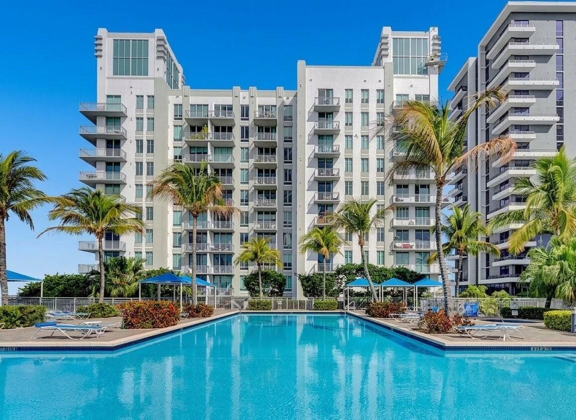 Located at 300 S Australian Ave #809 in the heart of West Palm Beach, this stylish condominium gives you a perfect blend of modern comfort and vibrant city living. Floor-to-ceiling impact windows fill the home with natural light while showcasing beautiful unobstructed views of Clear Lake. Enjoy easy access to downtown West Palm Beach's restaurants, shopping, entertainment, cultural attractions, and major transportation routes.   This well-maintained, secure building provides an exceptional lifestyle, whether you're looking for a primary residence, seasonal getaway, or investment opportunity.  A standout feature of this unit is the private storage unit-a valuable upgrade not included with every residence in the building. The property also includes one covered parking spa ce, with the option to purchase or include a second parking space.  This beautiful condo can be yours!  The HOA fee includes water, high-speed internet, sewer, trash service, building insurance, roof maintenance, grounds and structural maintenance, pest control, legal and accounting services, pool maintenance, and reserve funds, providing outstanding value and peace of mind.  Residents enjoy resort-style amenities, including a swimming pool, hot tub, fitness center, electric vehicle charging stations, BBQ area, clubhouse, business center, and billiards room.  Don't miss the opportunity to make this condominium your own in the heart of West Palm Beach.