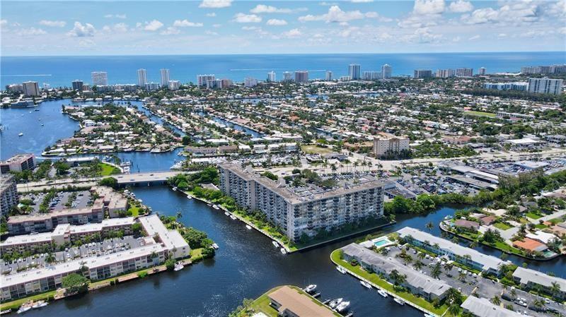 Location! Location! Location! Ground floor, Corner, End unit waterfront 2/2 condominium. See the waterviews and tropical landscaping from the screened patio with North exposure. No Elevators & only steps from the pool. Relax and watch the boats go by. Kitchen is open and has large granite island overlooking the dining and living room. SS Appliances. Well-managed onsite manager, financially stable community with reserves. Grounds impeccably maintained. Ammenities include tropical koi pond, large picnic/ barbecue area, clubhouse, billards, fitness room (being remodeled), sauna, library and boat dockage (when available). Beautiful updated lobby. Maintenance includes insurance, water, sewer, basic cable, car washing station and all exterior maintenance. Accordian shutters.