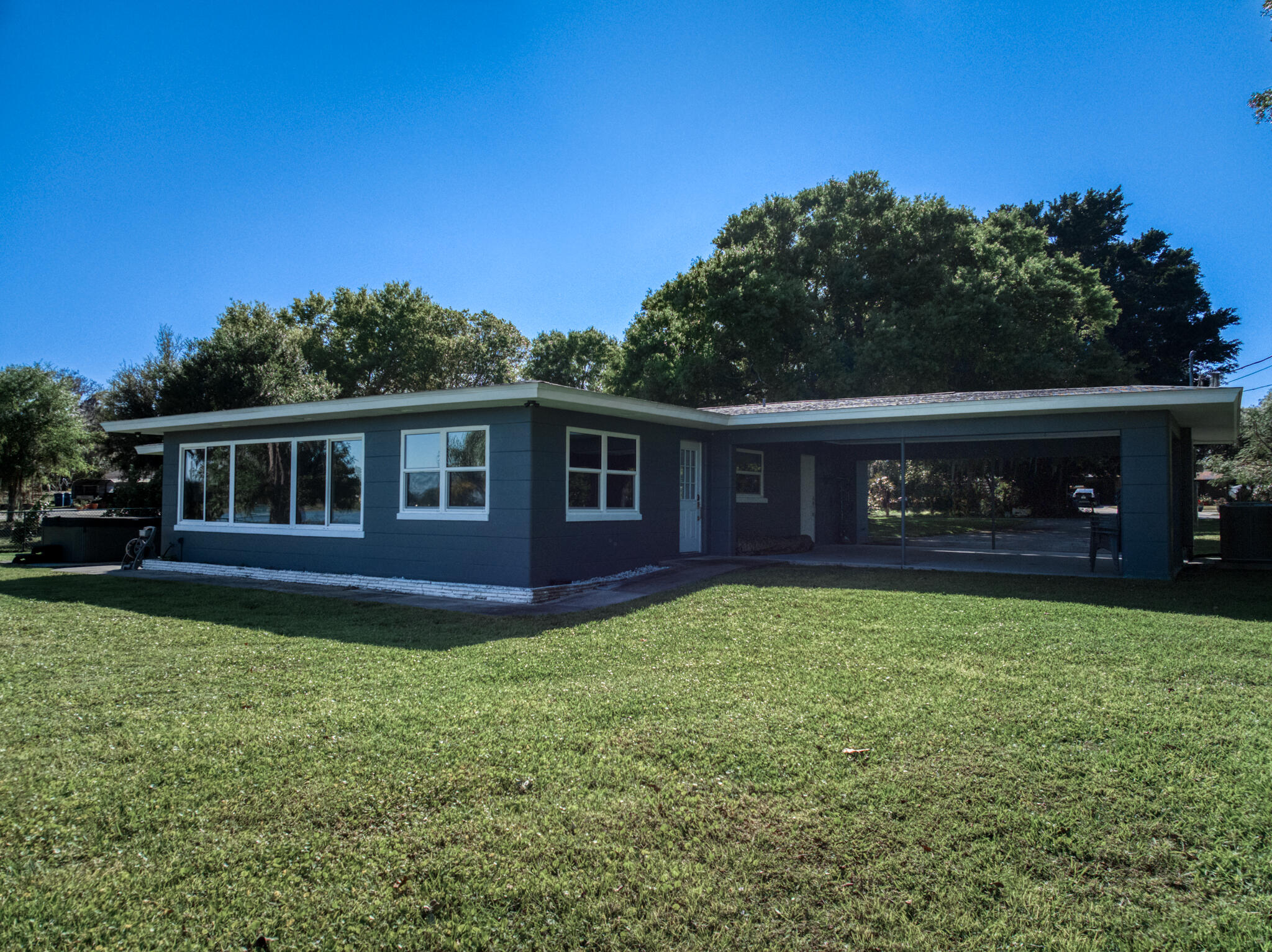 Completely remodeled 4-bed, 3-bath smart lakefront home on a quiet cul-de-sac, just minutes from Sebring's historic downtown circle & Sebring International Raceway. Inside, enjoy a brand-new kitchen featuring quartz countertops, Whirlpool stainless steel appliances, and a high-capacity Rheem tankless water heater. Smart-home upgrades include Kevo WiFi-enabled door locks, a Nest thermostat, WiFi attic fan, and a WiFi sprinkler system for effortless living.Windows with custom window treatments and motorized blinds in the living room easily allow you to enjoy the lake view. The 6-seat hot tub overlooks the lake or make the most of your private dock for fishing, boating, or simply soaking in the sunsets.Furniture is negotiable, making this home an easy, move-in ready escape. Turn off SR17 onto Assembly Point Drive. Once you reach the cul-de-sac at the end of Assembly Point Drive, turn right onto Dinner Lake Dr. The property is the last home on the left.