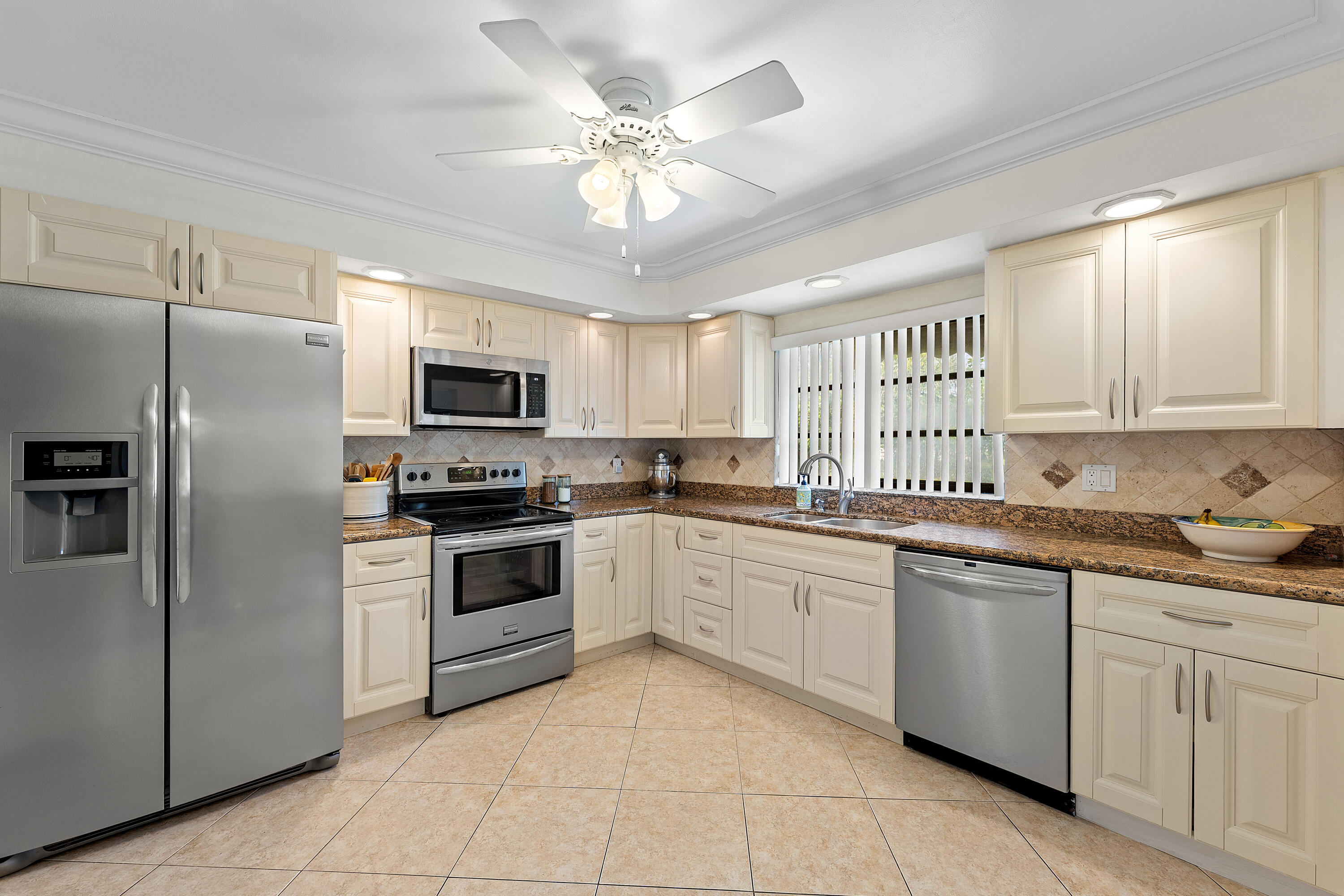 This well-maintained villa located in a cul-de-sac is priced to sell.  2-bedroom, 2-bathroom villa with a 1-car garage, offering comfort, convenience, and great value. Updated Kitchen and bathrooms.  This location is top notch, no rear neighbors and a huge side yard!  Enjoy peace of mind with a community that takes care of everything—six pools, exterior maintenance, building insurance, roof upkeep, lawn care, water, basic cable, and internet are all included. Ideally located near I-95 and the Turnpike, and just minutes from shopping, restaurants, hospitals, and more.