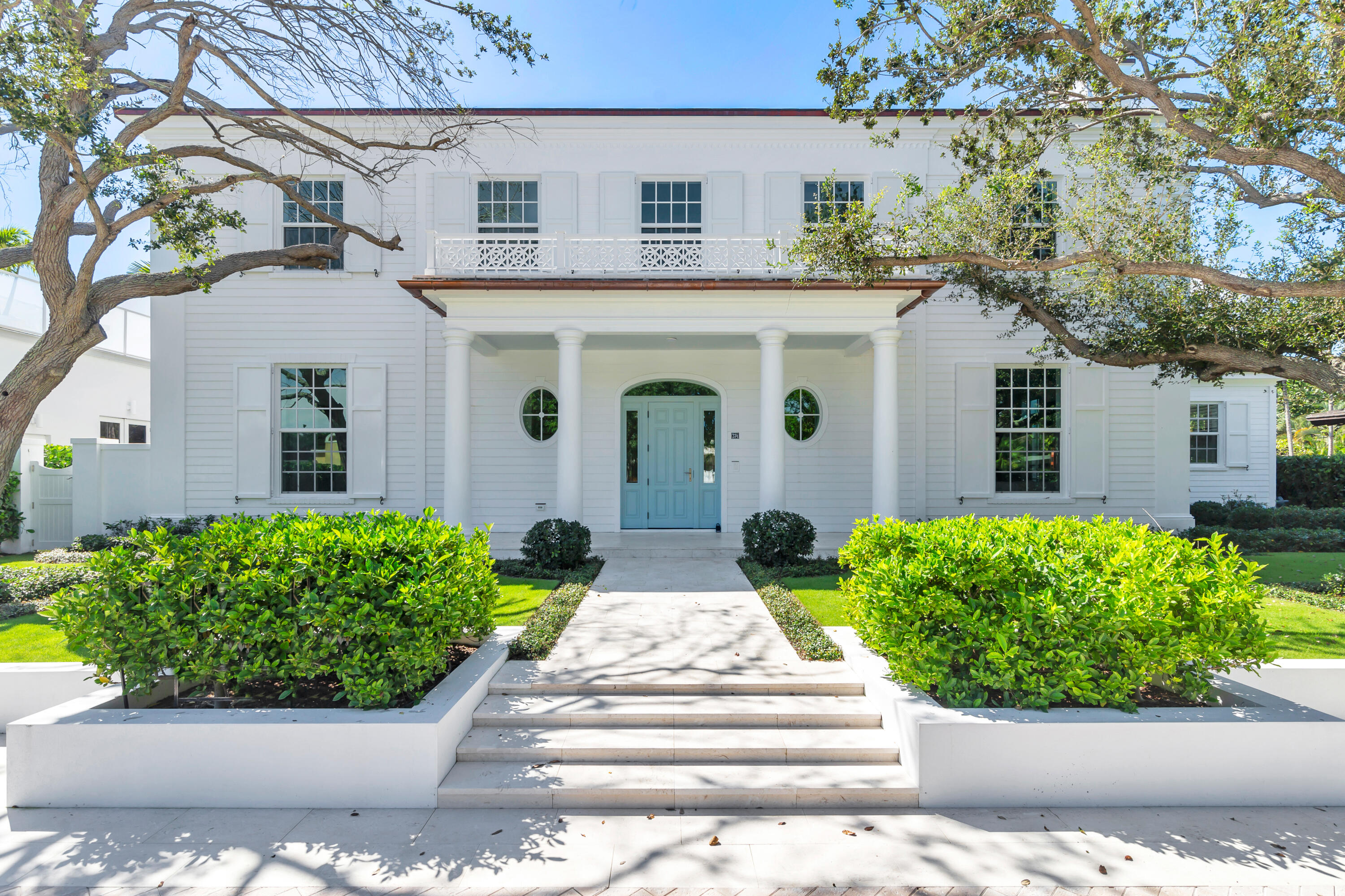 Welcome to this meticulously designed 5 bedroom, 4.5 bathroom estate with a private guesthouse, a masterpiece by Smith Kellogg Architects with interiors by Julia Amory. Situated on a rare 16,365 sqf lot just steps from the intracoastal waterway, this West Palm Beach gem offers nearly 5,800 sqf of beautifully curated living space. Inside, the home features white oak hardwood floors and 10'4''  plus ceilings, creating a spacious open feel. The kitchen comes equipped with a Sub-Zero refrigerator and freezer, dual dishwashers, a 6 burners gas range, two farmhouse sinks, and high-gloss cabinetry. It opens to a spacious family room and a light-filled dining room with charming built-in cabinetry and an additional farmhouse sink. A formal living room with a gas fireplace offers a space for gathering, complemented by a galley-style wet bar with an ice maker and dishwasher. Upstairs, the primary suite offers access to a spacious terrace with views of the gardens. It features his-and-hers walk-in closets, dual vanities, a Roman soaking tub, and a private water closet. Three additional bedrooms are located on the second floor, with a junior master suite on the main level. The backyard features a heated round swimming pool, lush landscaped gardens artfully designed by Nievera Williams Landscape Architects, and a spacious covered loggia ideal for outdoor entertainment or lounging. The private studio guesthouse offers a full bathroom and laundry. Additional highlights include a whole-house generator, security system, oversized mudroom & laundry room, plus a convenient second-floor laundry, and a 2-car garage with rear alley access. Located in the premier SoSo neighborhood, this home is just steps from the Flagler Drive Intracoastal bike trail, South Olive Park and Tennis Center, The Park Golf Course, as well as minutes from Palm Beach, the beach, downtown West Palm Beach, and the Palm Beach International Airport.