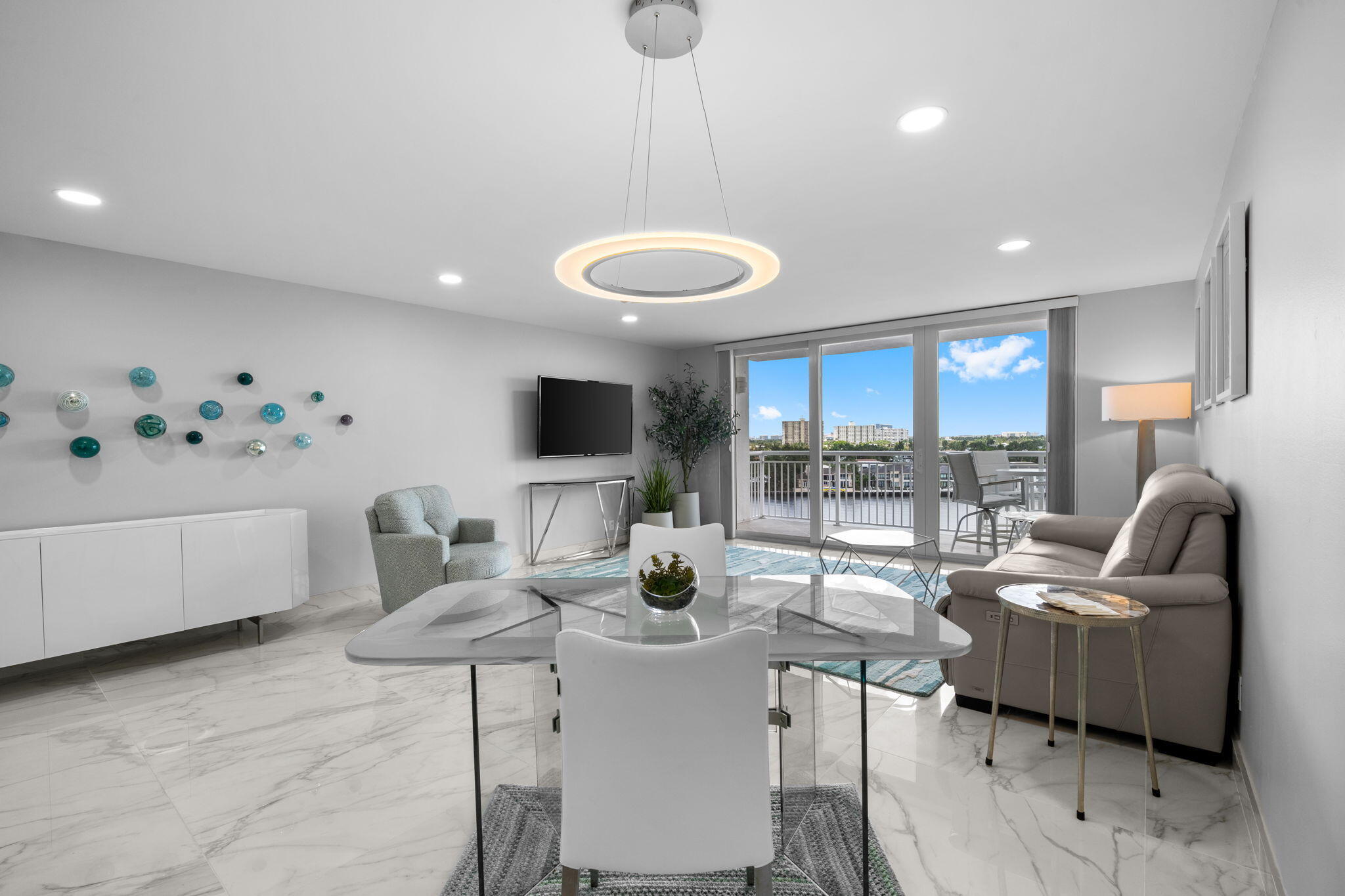 Welcome to Waterfront Living at It's Finest! This completely renovated 1 Bedroom/1 Bath residence at Bayshore Towers offers breath taking direct Intracoastal views and spectacular sunsets over the downtown skyline. Thoughtfully redesigned with modern finishes throughout, this turnkey residence is offered fully furnished with brand new designer furniture, creating a sophisticated coastal retreat ready for immediate enjoyment. Expansive water views provide the perfect backdrop for everyday living, while the ocean and stylish interior blends contemporary elegance with South Florida Charm. Bayshore Towers offers an array of resort-style amenities including waterfront pool, sauna, fitness center, and outdoor barbecue area-all set directly along the Intracoastal Waterway.
