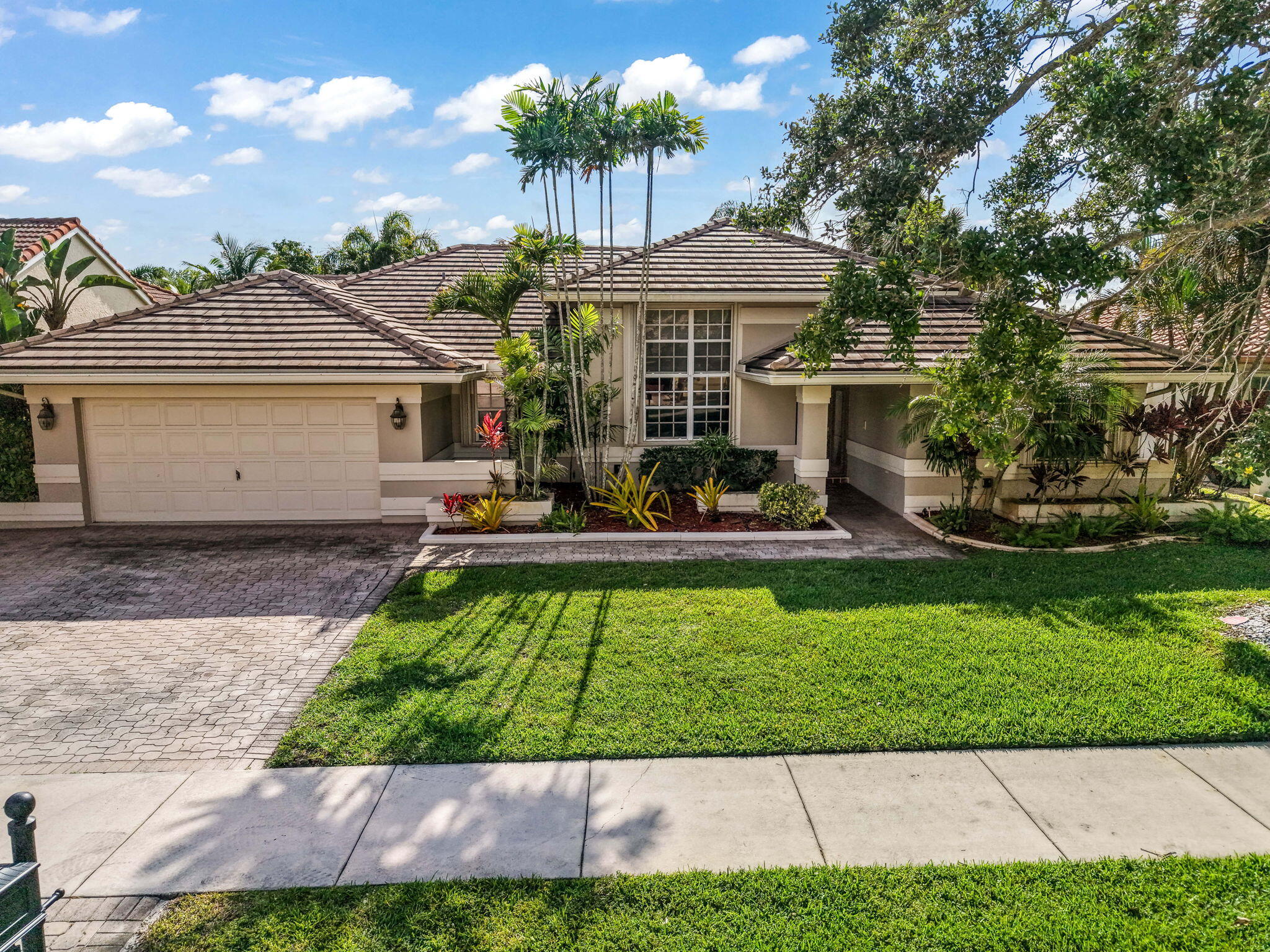 WE HAVE THE KEYS TO YOUR NEW HOME!!! Beautifully maintained 4-bedroom, 3-bath home in one of Davie's most desirable neighborhoods! This spacious residence offers its own private backyard oasis featuring a heated pool and spa with STUNNING lake views! Plus mature mango and avocado trees for a true tropical feel. Inside, the home features a versatile bonus room that can easily serve as a 5th bedroom, home office, gym, playroom, or guest space to fit your lifestyle needs. Ideally located just minutes from the 595 Expressway, around the corner from Publix, and within walking distance to Tree Tops Park, this location is hard to beat! 2019 roof  Major updates include a 2019 roof and 2023 water heater, offering added peace of mind for years to come. A rare opportunity to own a move-in ready