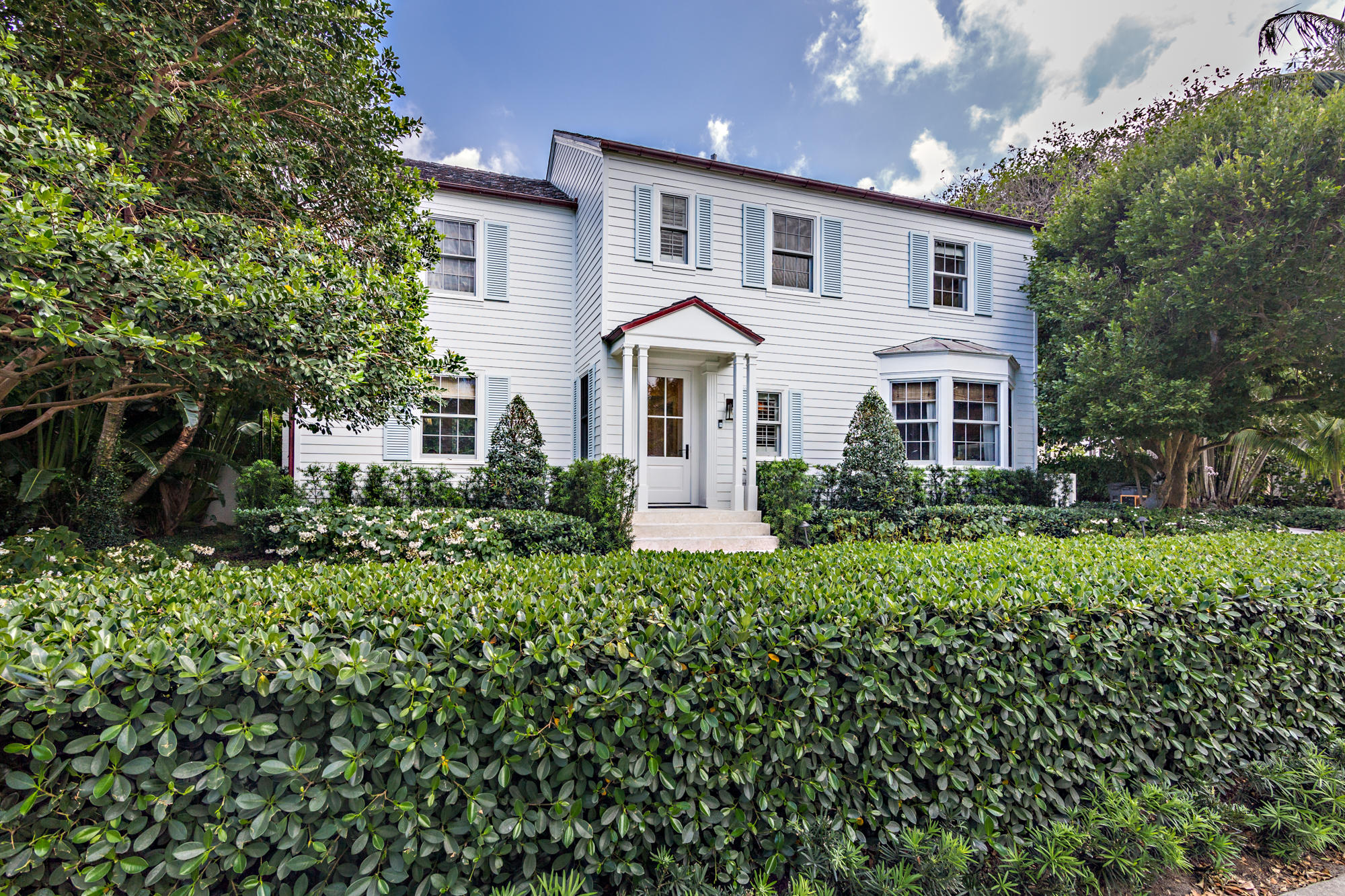 Classic Colonial designed by Maurice Fatio located on the desirable North End.  Home has undergone extensive renovations including new roof, windows, electric and plumbing.  Once you enter the home, you are greeted with amazing light due to the southern exposure of the home overlooking the expansive back yard.  The street itself has direct beach and lake trail access.  When you see this home think, ''Father of the Bride.''