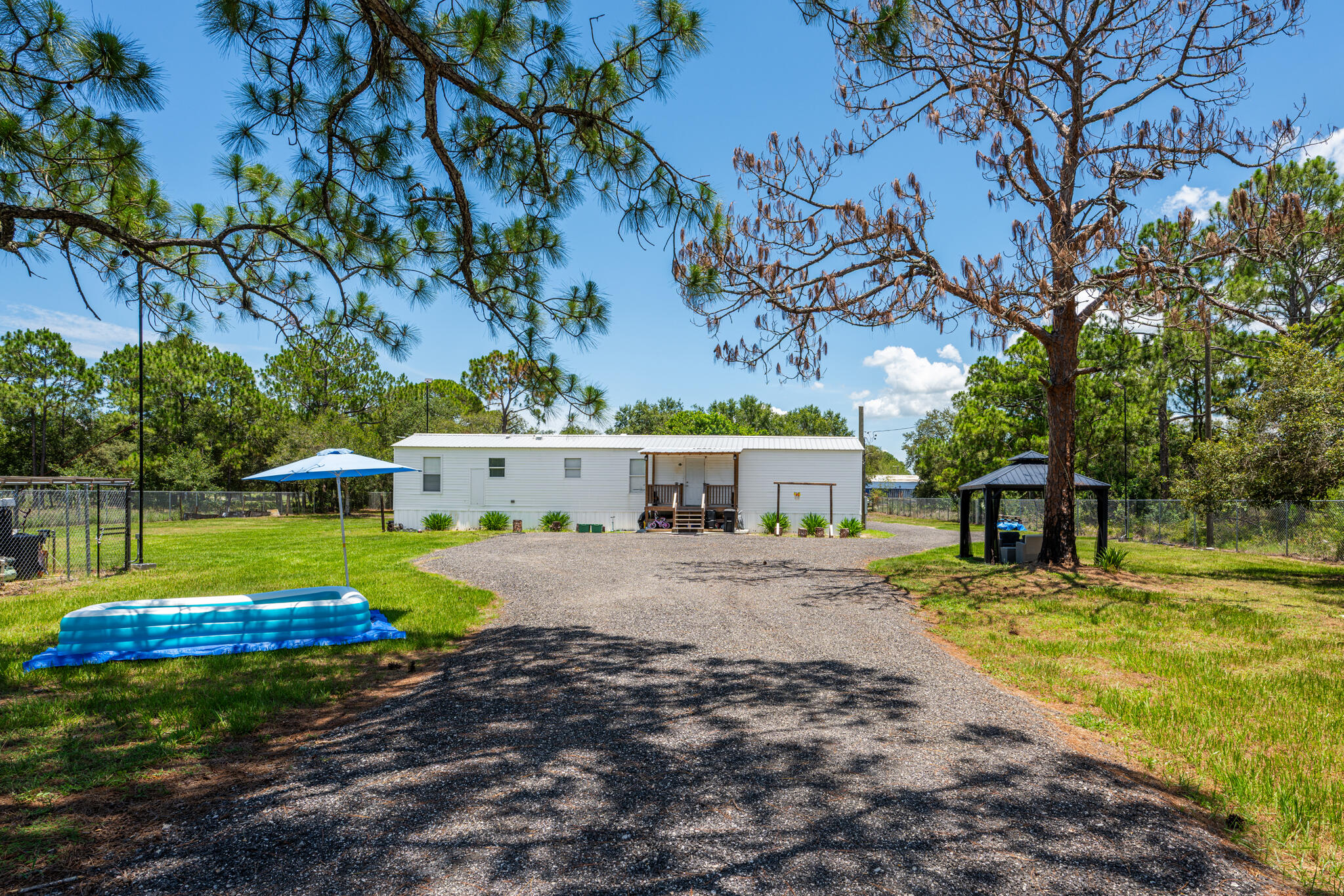 Come and see this nice 3-bedroom, 2-bathroom mobile home situated on 1.25 acres of land. You own the land, eliminating any lot fees. FHA loans are welcome, and the property also features a secure storage shed.