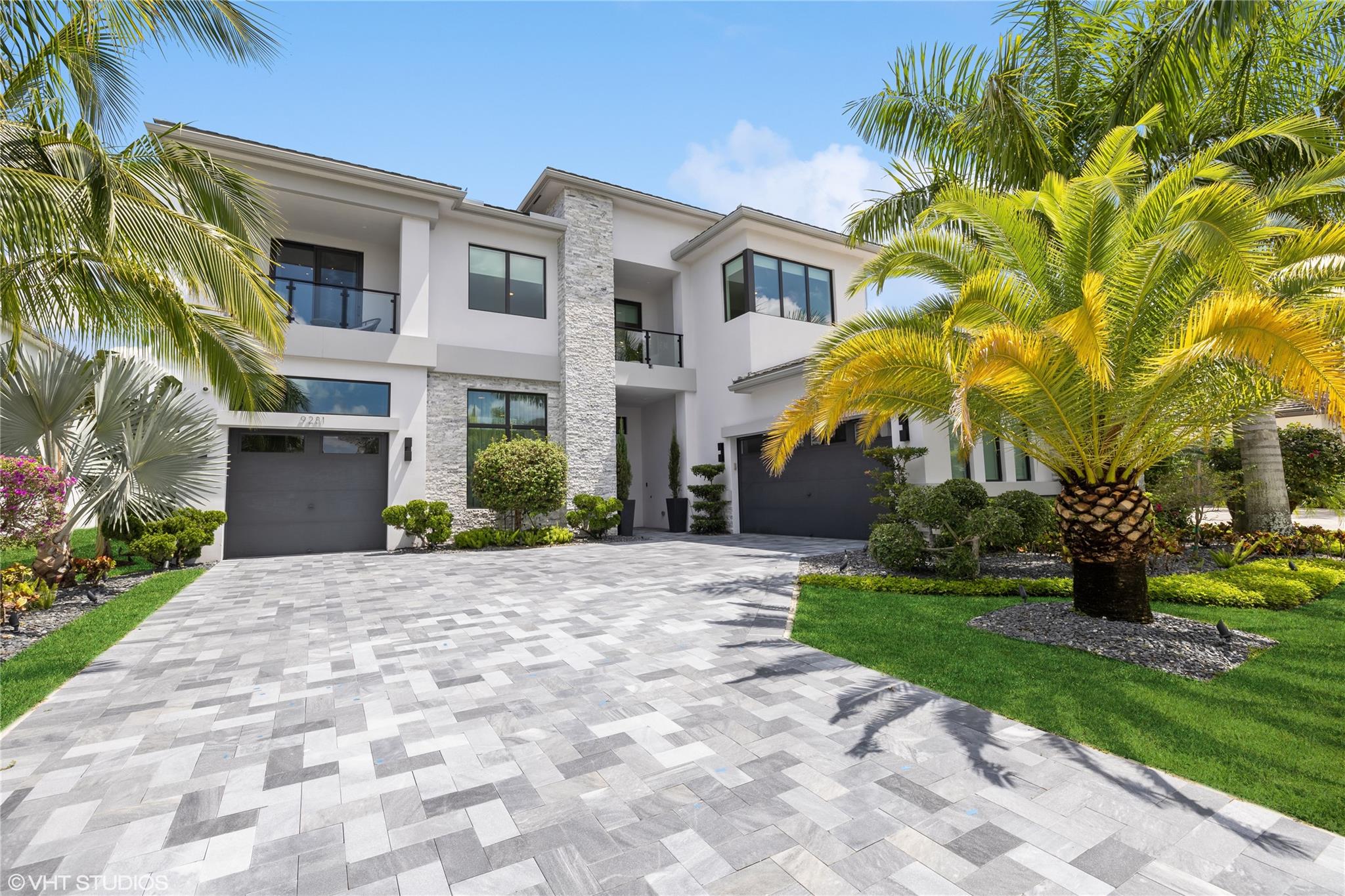 Luxury living in the highly sought-after Boca Bridges Veneto contemporary model. 2-story house with the primary bedroom down floorplan, 5 bedrooms and 5 full + 2 half bath, media room, loft, art studio with storage, den-game room and office. The home boasts 2-story ceilings in the living room and family room with contemporary wood details complimenting the glass stair rail. Huge 1st floor primary bedroom includes walk-in closets and bathroom with freestanding tub and separate shower. Beautifully done kitchen with 2 oversized islands and kitchen window, featuring Wolf, Sub Zero appliances. Contemporary pool with gorgeous marble deck overlooking the lake and lushes landscaping gives you a privacy. Marble pavers on the driveway add a touch of luxury to the exterior. Cul-de-sac street.