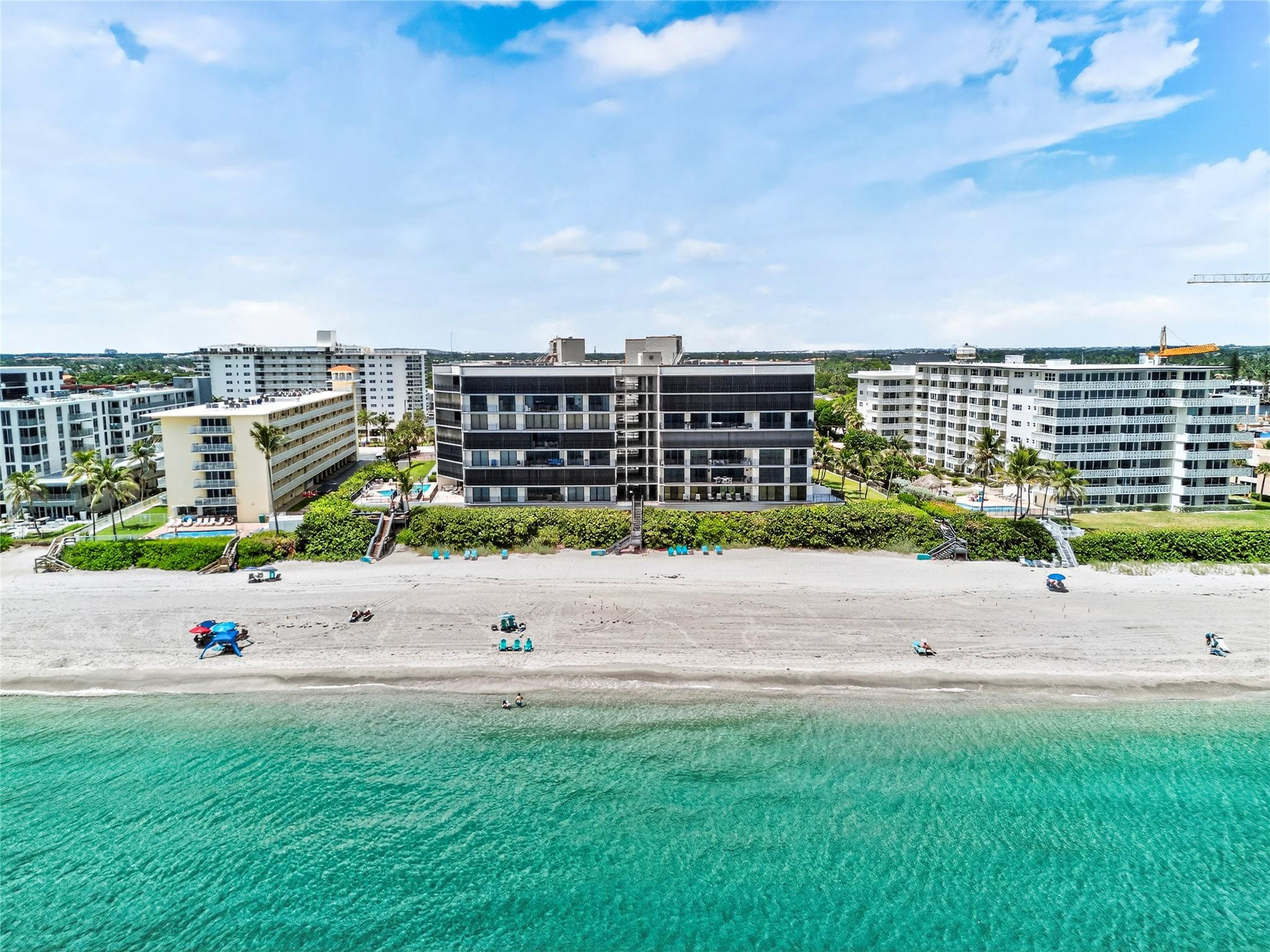 Welcome to your dreamy beach retreat on the exclusive Hillsboro Mile! This updated 2 bed, 2.5 bath condo is just steps from the sand, with refreshing sea breezes and ocean views from a private 400 sq ft balcony. Inside you’ll find modern finishes, impact windows/sliders, a new A/C unit and a gorgeous kitchen with granite countertops and new LG smart appliances. Both spacious bedrooms feature walk-in closets and spa-like baths. Added comforts include in-unit laundry, electric shades, and 2 deeded covered parking spaces. The pet-friendly Overlook Condo delivers a premier lifestyle with private beach access, heated pool, fitness center, tennis/pickleball courts, and a clubhouse overlooking the Intracoastal. Dock space is available too. Don't miss this opportunity to own a slice of paradise!