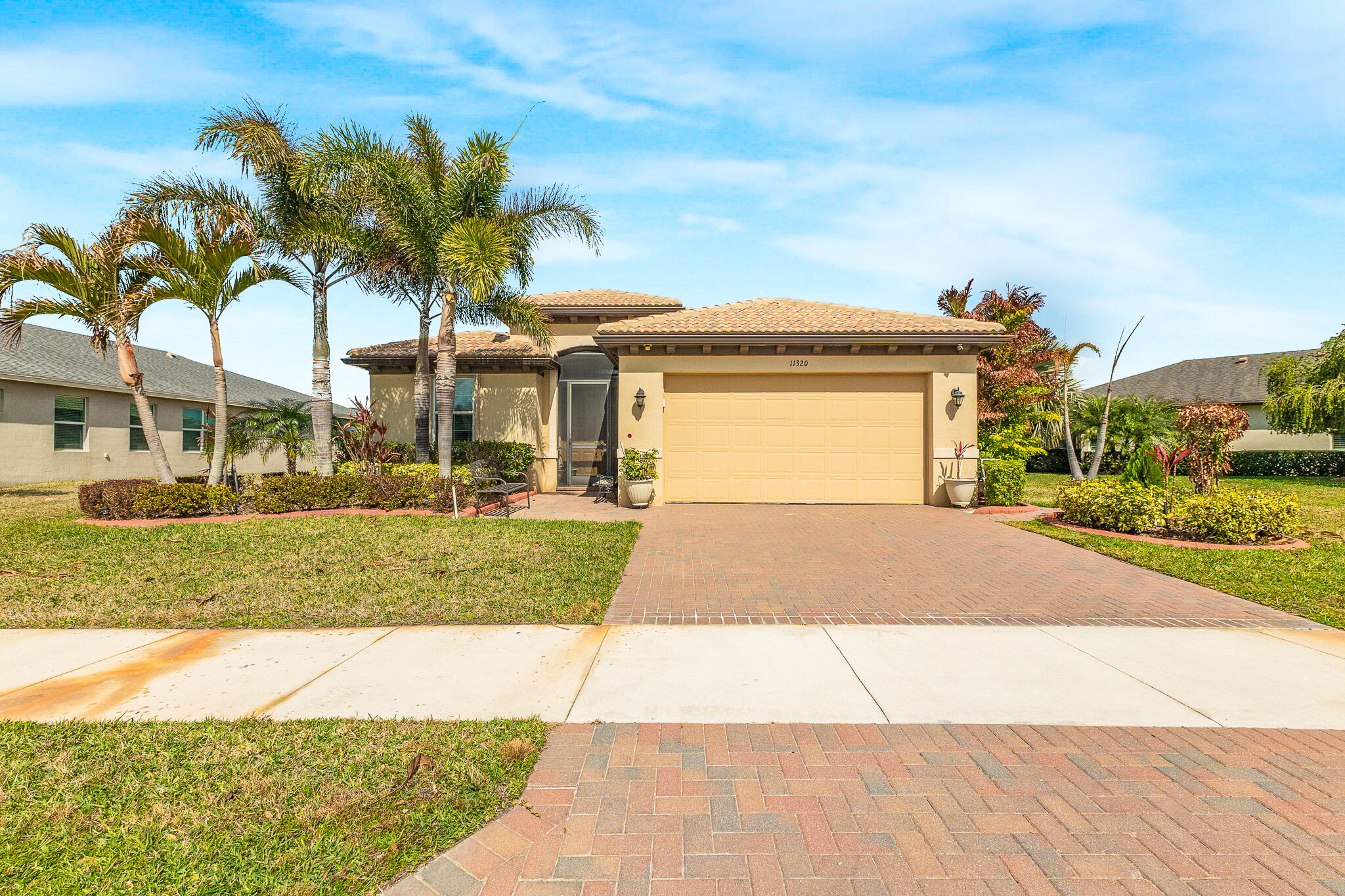 Welcome to Lake Park at Tradition, This Beautiful Lakefront CBS Home Offers 2 Bed W/ Den, 2.5 Bath and an Open Floor Plan. Many Upgrades Include Crown Molding Throughout, Screened Lanai Plus an Extended Paver Area Overlooking the Lake. The Updated Kitchen Has Subway Style Backsplash, Wall Oven, Island Kitchen with Granite Counters, Ceiling Fans in All Rooms and on the Lanai, Whole Home Water Conditioner System, Garage Door Opener and Storage Shelves in the Garage. To Complete this Home, it also has an Instant Hot Water Heater. The Home is Beautifully Decorated with A Formal Dining Room as well as a Kitchen Nook, Formal Living Room and Family Room. This Gated Community Has a Club House, Two Pools and Many Activities. Call Today!