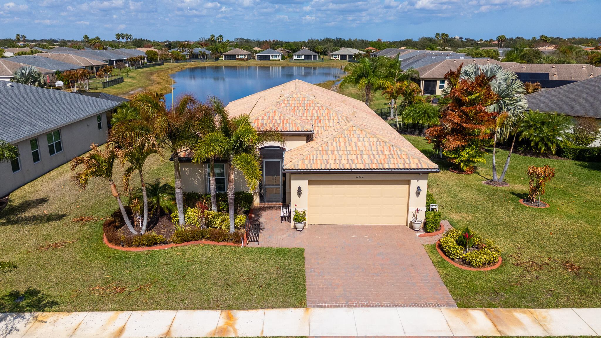 Happy 4th of July, we are Offing an American Home Shield Warranty! Let's Make a Deal/ Motivated Seller. Welcome to Lake Park at Tradition, This Beautiful Lakefront CBS Home Offers 2 Bed W/ Den, 2.5 Bath and an Open Floor Plan. Many Upgrades Include Crown Molding Throughout, Screened Lanai Plus an Extended Paver Area Overlooking the Lake. The Updated Kitchen Has Subway Style Backsplash, Wall Oven, Island Kitchen with Granite Counters, Ceiling Fans in All Rooms and on the Lanai, Whole Home Water Conditioner System, Garage Door Opener and Storage Shelves in the Garage. To Complete this Home, it also has an Instant Hot Water Heater. The Home is Beautifully Decorated with A Formal Dining Room as well as a Kitchen Nook, Formal Living Room and Family Room. This Gated Community Has a Club House, Two Pools and Many Activities. Call Today!