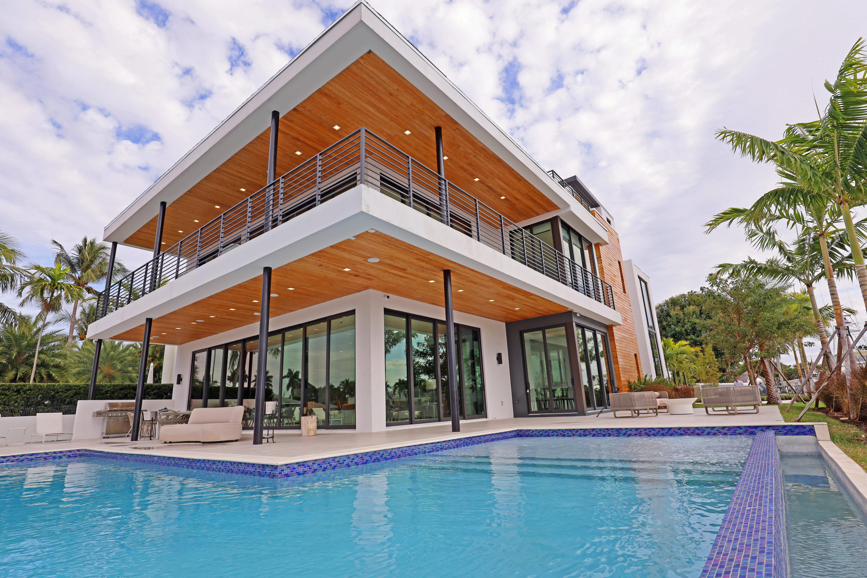 Unique opportunity to enjoy this New 3- levels Modern Intracoastal Point Lot property planted on 240 feet water-frontage in Hillsboro Shores. Tastily crafted by Design group, Interior finishes by Togu Miami and built by Sabal Development.Impressive Master suit with wraparound balcony and astonishing water view. Huge closets. Custom Italian Chef's kitchen with separate butler's/chef station. Pool with spa. Elevator, solid oak doors. 150 SF of Dockage. Dream and easy access for a mega yacht just minutes away from Hillsboro Inlet.