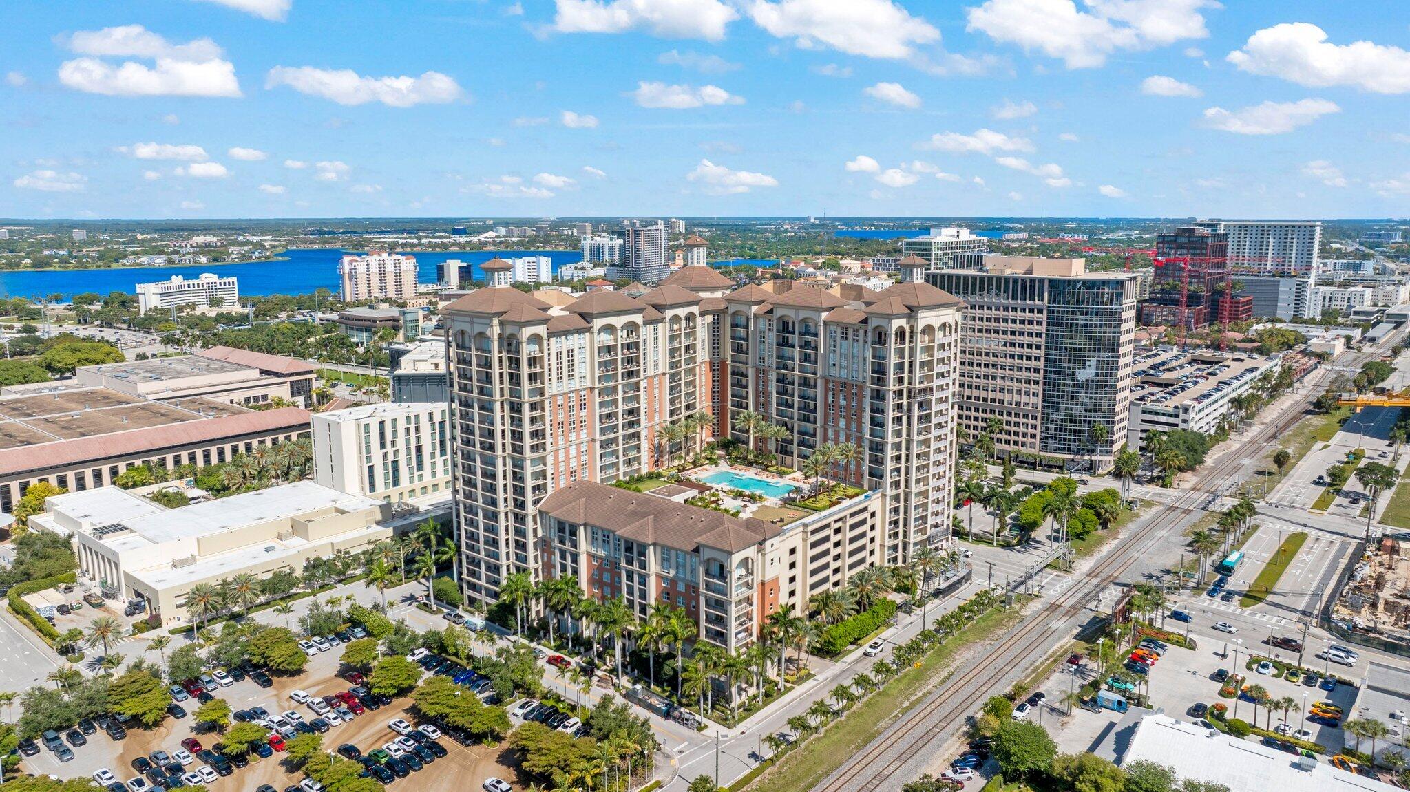 INTERIOR PHOTOS COMING SOON! Now available in the pristine CityPlace South Tower! 1609 provides sunrise and sunset views with East + West exposure off your expansive balcony, front row seat of firework shows, and views of the ocean and Palm Beach Island.  The interior is a well-designed, split, 2-bed floor plan maximizing ease and functionality. Electric blinds on all windows. Covered parking and a large storage cage are deeded to the unit. Across the street from Rosemary Square and just over the bridge from Palm Beach Island and Worth Avenue, this location is unbeatable. Just 5 minutes to Palm Beach International Airport as well. Resident only amenities include heated pool, hot tub, outdoor kitchen, and fitness center. Pet friendly building. Free valet parking and 24-hour doorman.