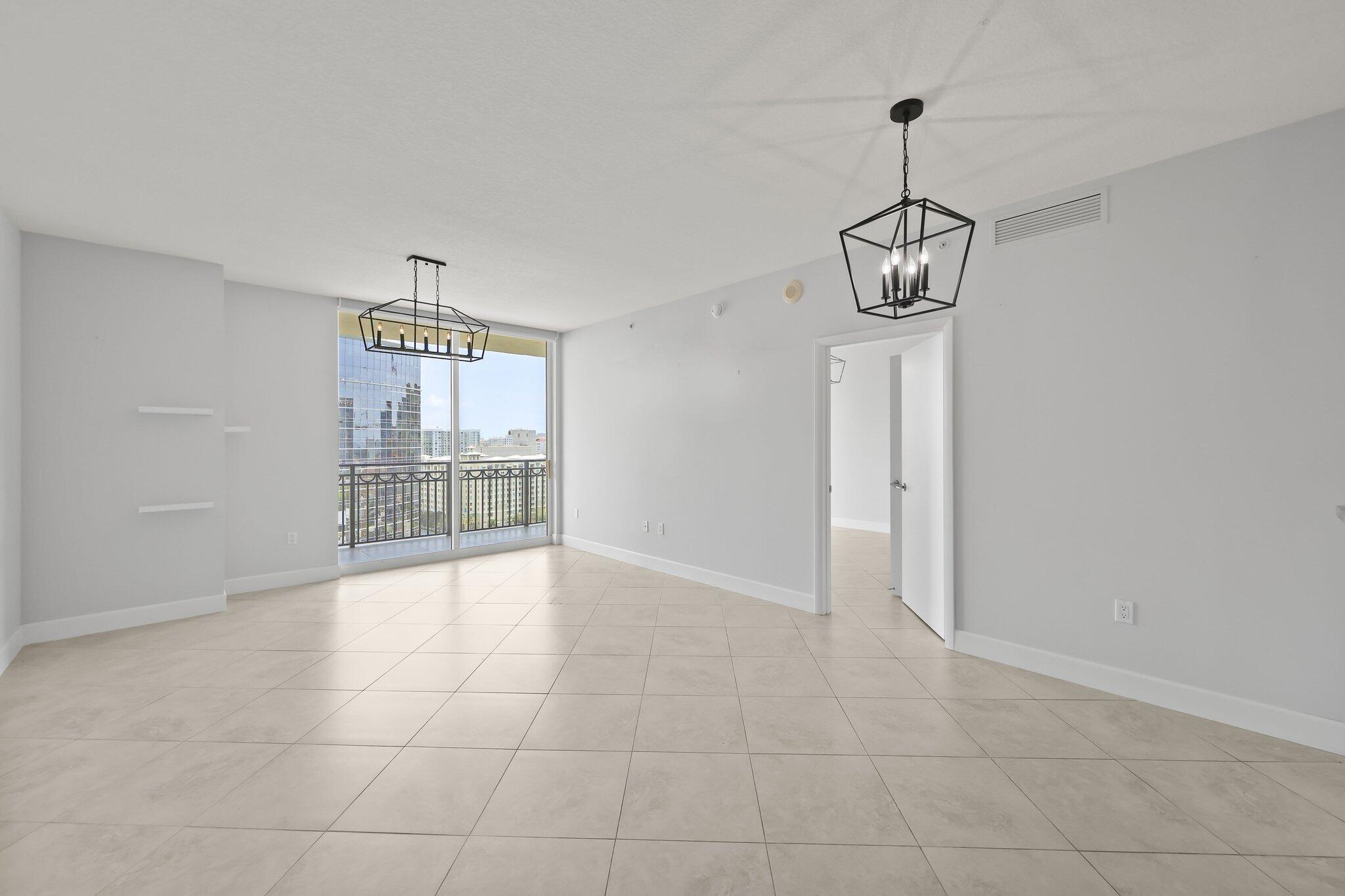 Now available in the pristine CityPlace South Tower!  Residence 1609 offers breathtaking sunrise and sunset views with desirable east and west exposure from your expansive private balcony, providing a front-row seat to holiday fireworks, along with stunning views of the Atlantic Ocean and Palm Beach Island.  Inside, you'll find a thoughtfully designed split two-bedroom floor plan that maximizes comfort, functionality, and privacy.  Electric blinds are installed throughout, and the residence includes deeded covered parking along with a spacious private storage cage.  This residence is a true blank canvas ready for your personal vision.  Cityplace South Tower has exquisite finances and is run like a dream from management to the valet staff and doormen and everywhere in-between. Perfectly situated directly across from Rosemary Square and just over the bridge from Palm Beach Island and Worth Avenue, this premier location truly can't be beat.  Palm Beach International Airport is also just five minutes away.  Residents enjoy an impressive collection of amenities, including a heated pool, hot tub, outdoor kitchen, fitness center, 24-hour doorman, complimentary valet parking, and a pet-friendly atmosphere.