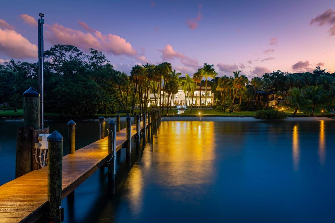 Stunning gated, turnkey customized deep water140ft waterfront luxury resort style home is situated .976 an acre of land in So.Sewall's Pt. Stuart,FL. Private dock can hold vessel up to 90ft w/2 new Neptune lifts.New piling.No fixed bridges. New sea wall. Upon entering the grand doorway, you're immediately swept away by panoramic water views that set the stage w/uncompromised elegance.A grand staircase leads the way to a world of opulence w/i the home.Gourmet chef's kitchen is a culinary enthusiast's dream,equipped w/high-end SS Thermador gas range,w/island,.New quartzite kitchen counter with accent lighting,dual coquina fireplace,billiard rm,gym, sauna,new salt water pool,spa &pavers.This estate offering a truly unparalleled living experience.A rare gem awaiting its discerning new owner.