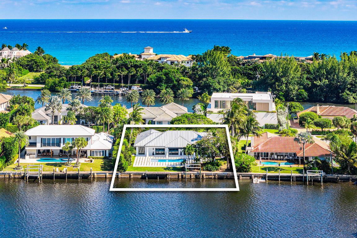Just completed and rarely available is this exquisitely rebuilt waterfront residence in the coveted, guard-gated community of Point Manalapan. Known for its privacy, security, and upscale lifestyle, Manalapan offers an exclusive island setting unlike anywhere else. This transitional modern home has undergone a meticulous, multi-year, ground-up renovation, delivering the finest in turn-key luxury living. Everything about this extraordinary home is BRAND NEW! Including new high impact windows / doors, garage doors, roof, electrical, plumbing, appliances, HVAC, hot water, interiors/exteriors, pool, hardscape/landscape, dock, and more.

With over 4,000 total square feet, the home features 4 bedrooms, 4.1 baths, a stunning heated saltwater pool overlooking the water , a spacious 2-car garage, a whole-house generator, and countless premium finishes throughout. Every detail has been thoughtfully crafted to create a refined, modern living experience, all set against the tranquil backdrop of Manatee Cove, with far-reaching water views and sensational sunsets.

Residents of Manalapan enjoy complimentary access to the exclusive La Coquille Club and Larry Ellison's world-renowned 5-star Eau Hotel & Spa, home to Nobu Manalapan. Opportunities like this are exceptionally raredon't miss your chance to call Manalapan home.
Shown by appointment to qualified buyers.