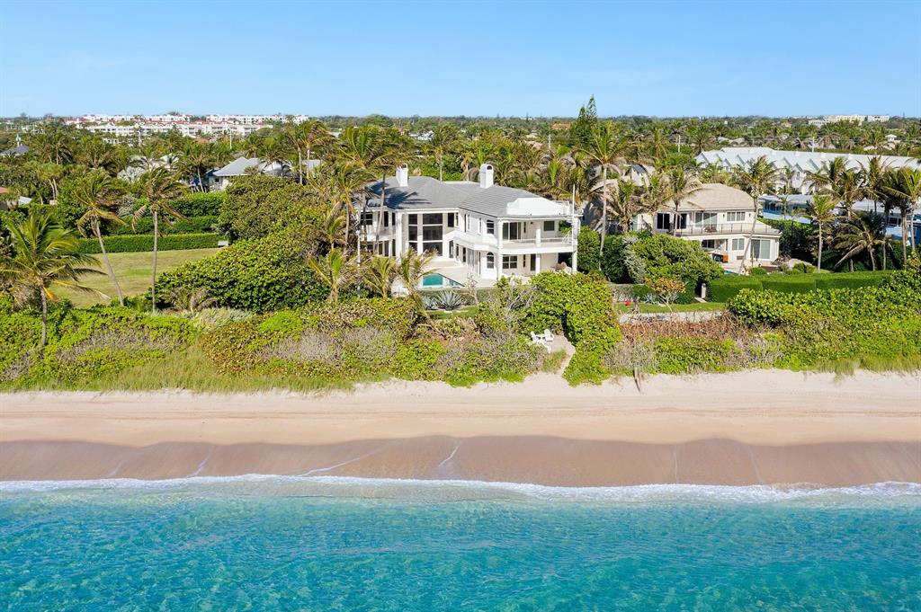 Oceanfront estate home on 3/4 acre including 100' x 124' ft direct oceanfront parcel. The residence is perfectly sited on a privately owned cul de sac east of A1A. Enter through the gated motor court, double mahogany grand front doors lead to the light filled living room & expansive ocean views.  A spacious kitchen, complete with chef-quality appliances is wide open to the family room & more ocean vistas.  The first floor has 2 large guest suites.  Upstairs the enormous Master suite encompasses a sitting room with fireplace, expansive bath, immense closet, safe room and tremendous ocean views.  A private loggia off the master is the ideal spot for watching the waves.  Three more en suite bedrooms complete the 2nd floor including a separate suite ideal for in-laws or nanny and home office. Oceanfront estate home on 3/4 acre including 100' x 124' ft direct oceanfront parcel. The residence is perfectly sited on a privately owned cul de sac east of A1A. Enter through the gated motor court, double mahogany grand front doors lead to the light filled living room & expansive ocean views.  A spacious kitchen, complete with chef-quality appliances is wide open to the family room & more ocean vistas.  The first floor has 2 large guest suites.  Upstairs the enormous Master suite encompasses a sitting room with fireplace, expansive bath, immense closet, safe room and tremendous ocean views.  A private loggia off the master is the ideal spot for watching the waves.  Three more en suite bedrooms complete the 2nd floor including a separate suite ideal for in-laws or nanny and home office.The ocean front patio/ deck with a fire pit is nestled in the dune surrounded by seagrapes for privacy. The property is fully fenced and gated. Other features include: elevator, generator, full hurricane protection, 3 car garage, & AC'd workshop.