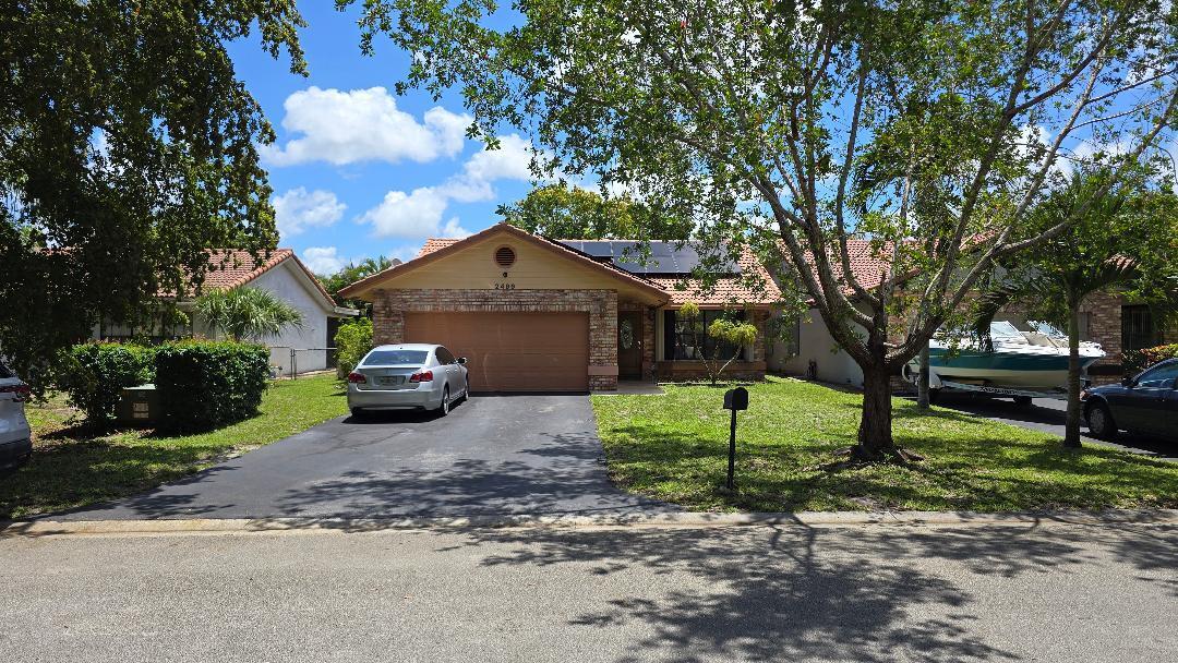 Beautiful 4-bedroom, 2-bath pool home in desirable Coral Springs featuring spacious living areas, a private backyard with sparkling pool, and a brand-new Solar Panels. Perfect for entertaining and conveniently located near schools, shopping, dining, and major highways. Move-in ready!