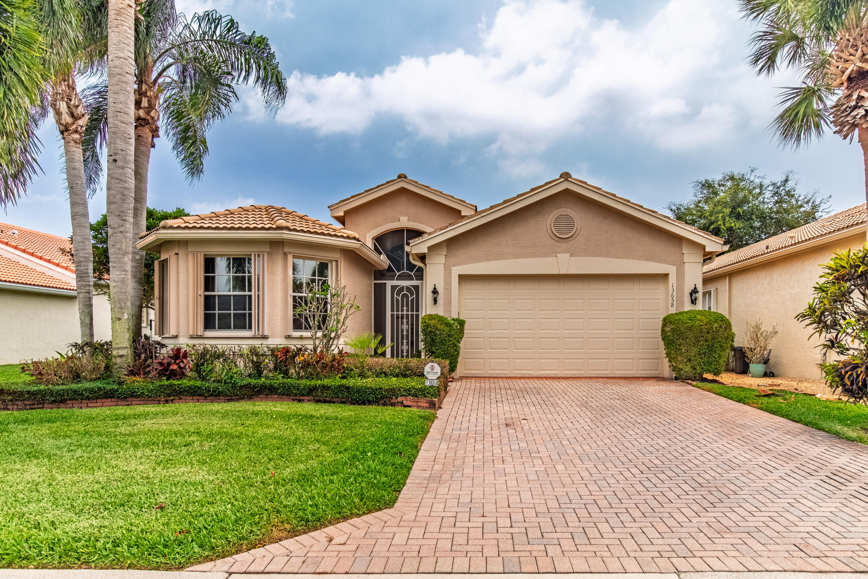 This stunning, freshly painted 3-bedroom, 2.1-bath INDIAN model is perfectly situated on a serene tropical lakeview lot in the highly desirable, vibrant 55+ Valencia Palms community. Offered as an unfurnished annual rental, this home is a pristine blank canvas ready for your personal touch. A light-filled interior welcomes you with a dramatic foyer that opens to elegant formal living and dining rooms, ideal for both entertaining & everyday comfort. The sunny kitchen features 42'' cabinetry, granite countertops, & a fabulous breakfast nook, while transom windows throughout flood the spacious family room with natural light.As a resident, your annual lease grants you full access to the legendary Valencia Palms lifestyle. Move right in & immediately enjoy true resort-style living.    This freshly painted interior & meticulously maintained INDIAN model 3/2.5 home offers complete peace of mind with a brand-new roof being installed, Additional custom upgrades include renovated bathrooms moldings, wainscoting, glass shower doors, and full accordion shutters. Your rent covers full cafe card, high-speed internet, premium cable with all channels, home security alarm monitoring, lawn/tree care, and exterior pest control. Tenant Amenities & Community Highlights: The Clubhouse features state-of-the-art Fitness Center, Grand Ballroom for professional shows and active social clubs. Poolside Luxury: Resort-style pool, dedicated lap pool, resistance pool, and an on-site Café for easy dining. Racquet Sports & Recreation: Premium pickleball, tennis, and bocce ball courts, plus a billiards room. Available for immediate annual occupancy. Treat yourself to the luxury, convenience, and vibrant social calendar of Valencia Palms!