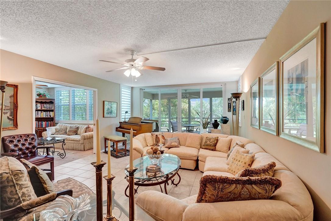 Welcome home! Beautiful 3-bedroom, 2 full bath, 1 1/2 bath split floor plan condominium located in sought after Palm Aire. This spacious 1,710 square foot unit offers a captivating view of the golf course from the screened-in balcony. With new impact windows & plantation shutters, the condo ensures both peace of mind and elegance. This condo features newer washer, dryer, and hot water heater. This condo also comes with a large storage unit located on the same floor. Residents of this well-maintained complex have access to two pools to enjoy the Florida sun. Discover the charm of Palm Aire while enjoying the beautiful landscaping and amenities it offers. Palm Aire is centrally located close to Publix, shopping, restaurants, and more.