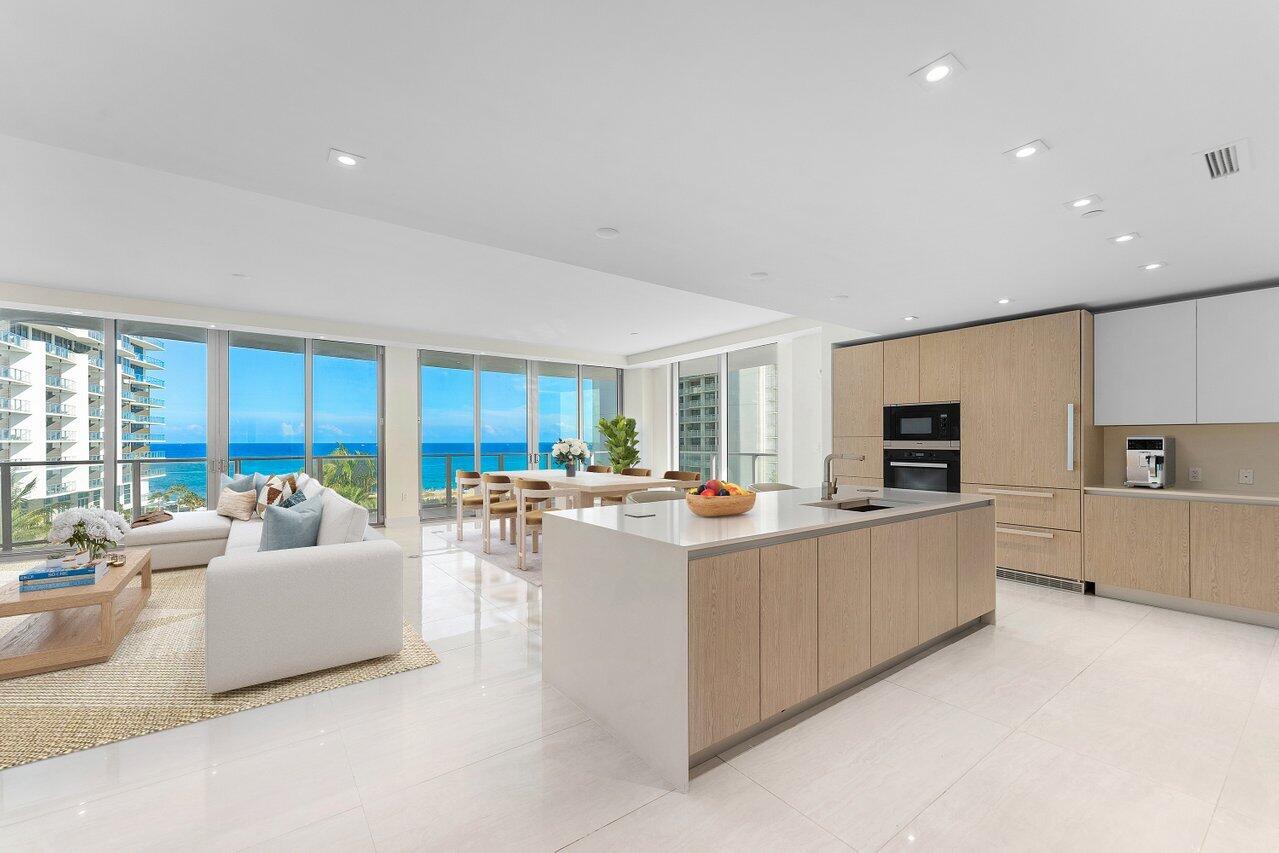 Start your day with breathtaking ocean sunrises and end it with serene intracoastal sunsets from this beautiful spacious corner residence featuring 2 bedrooms, 2.5 bathrooms, a den, and 900 SF of outdoor living across two wraparound terraces. Encompassing the full southeast corner of the Peace Tower building, completed in 2023, this stunning residence offers the largest floor-plan, floor to ceiling windows paired with breathtaking, unobstructed views of both the ocean and the intracoastal from every room. Whether you're lounging in the spacious living area, preparing culinary delights in your new gourmet kitchen, or unwinding in the lavish master suite, every moment is enhanced by the mesmerizing backdrop of endless ocean and intracoastal views. With high-end finishes, and top-of-the-line Miele appliances, every detail has been carefully curated to exceed the expectations of even the most discerning residents. Amrit residents enjoy a suite of white-glove services. Outside your doorstep, a world of resort-style amenities awaits. Amrit is a Wellness Resort set on just under 8 acres with over 300' of oceanfront. Over 100,000sqft of Wellness Amenities, incl. a 56,000sqft world-class spa. Take a dip in the pool overlooking the ocean, or unwind in the hot tub as you soak in the breathtaking scenery. Take advantage of the four on-site restaurants. Stay active and healthy in the state-of-the-art fitness center, or pamper yourself with a rejuvenating spa treatment, indulging in the ultimate relaxation experience. Amrit offers contemporary coastal living with unmatched amenities and lifestyle in The Palm Beaches. Located on serene Singer Island, just minutes from world-class shopping, dining, golf courses and marinas. Whether you're seeking a peaceful retreat, an active lifestyle, or simply a place to unwind and recharge, the Amrit Ocean Resort & Residences offers the perfect blend of luxury, comfort, and convenience. Immerse yourself in the unparalleled beauty of Singer Island and experience coastal living at its finest. Ideal for dog lovers, with two pets permitted, and a dog park onsite.