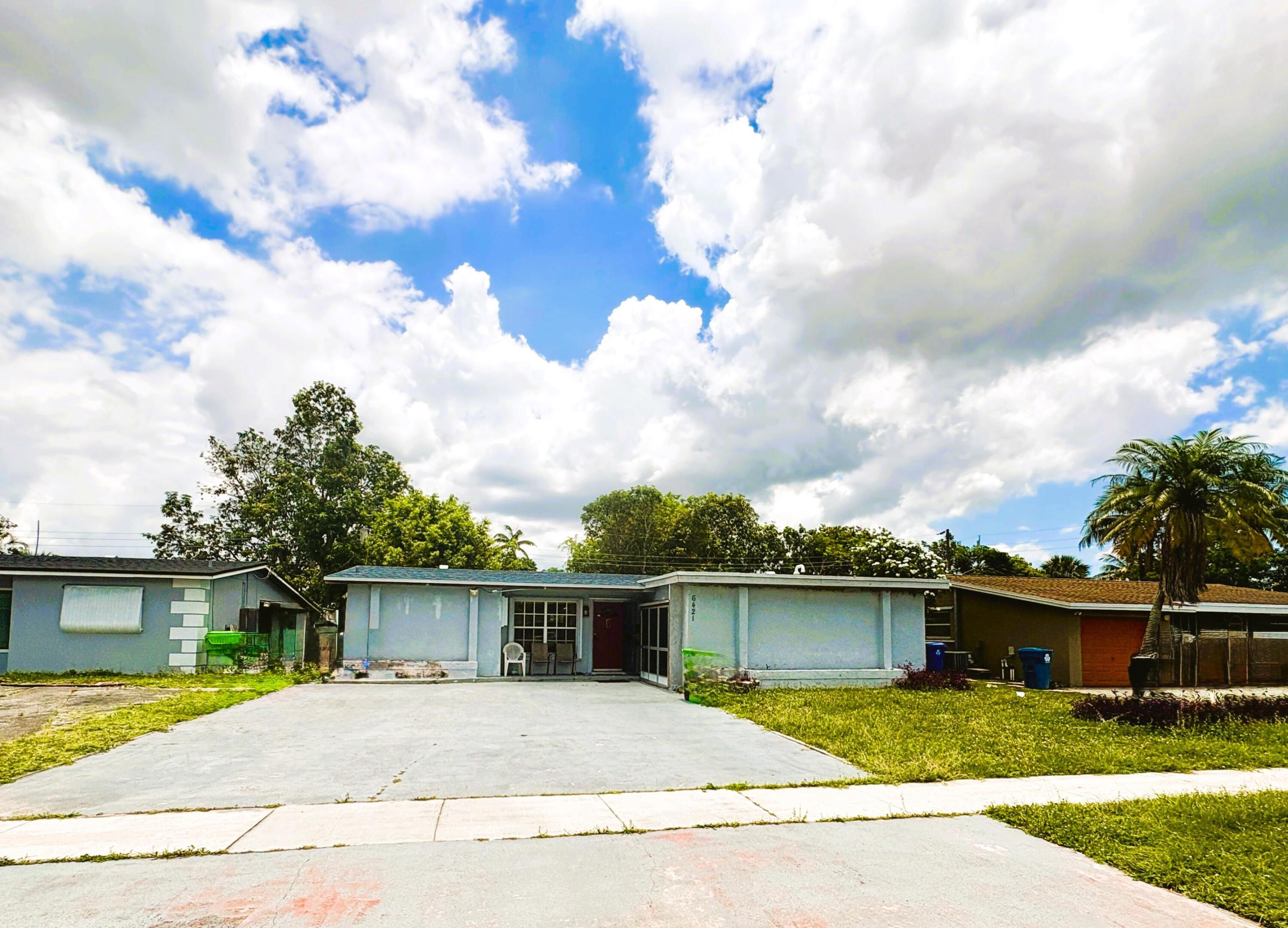 Expanded 2 bed 2 bath with new roof 2023, tankless water heater system, all upgraded appliances, modern Refrigerator, converted garage with laundry area, back shed joins the main roof, large yard and more. Outside, you'll find ample parking with a huge concrete driveway, a one-car garage, and a spacious fenced backyard—perfect for entertaining, pets, or outdoor enjoyment.  This move-in-ready property offers comfort, character, and value all in one package.