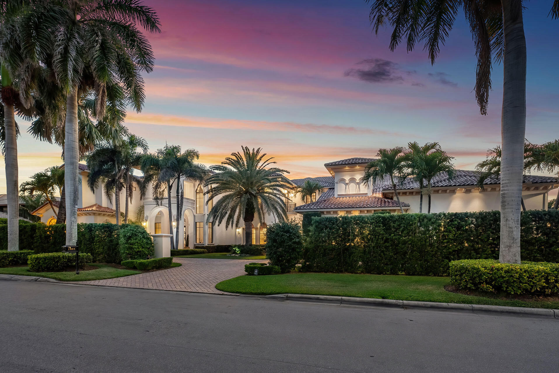 This double-lot golf course home in the prestigious Royal Palm Yacht & Country Club, boasts 207 feet of golf frontage, offering stunning views overlooking three Jack Nicklaus fairways!
Step into paradise as you enter the expansive outdoor oasis featuring a heated, two-tier, child-friendly pool with a spa and playful water sprays. Entertain guests or unwind in style on the covered terrace, where a natural gas fireplace adds warmth and ambiance to cool evenings under the stars.
The interior of this magnificent home is equally impressive, with first and second-floor master suites offering serene pool views and luxurious accommodations. The gourmet open-air kitchen is a chef's dream, featuring custom cabinetry, integrated appliances, and a huge walk-in pantry, perfect for culinary creation creations and entertaining in grand style. Take advantage of this rare opportunity to own a double-lot estate in one of Boca Raton's most exclusive communities.