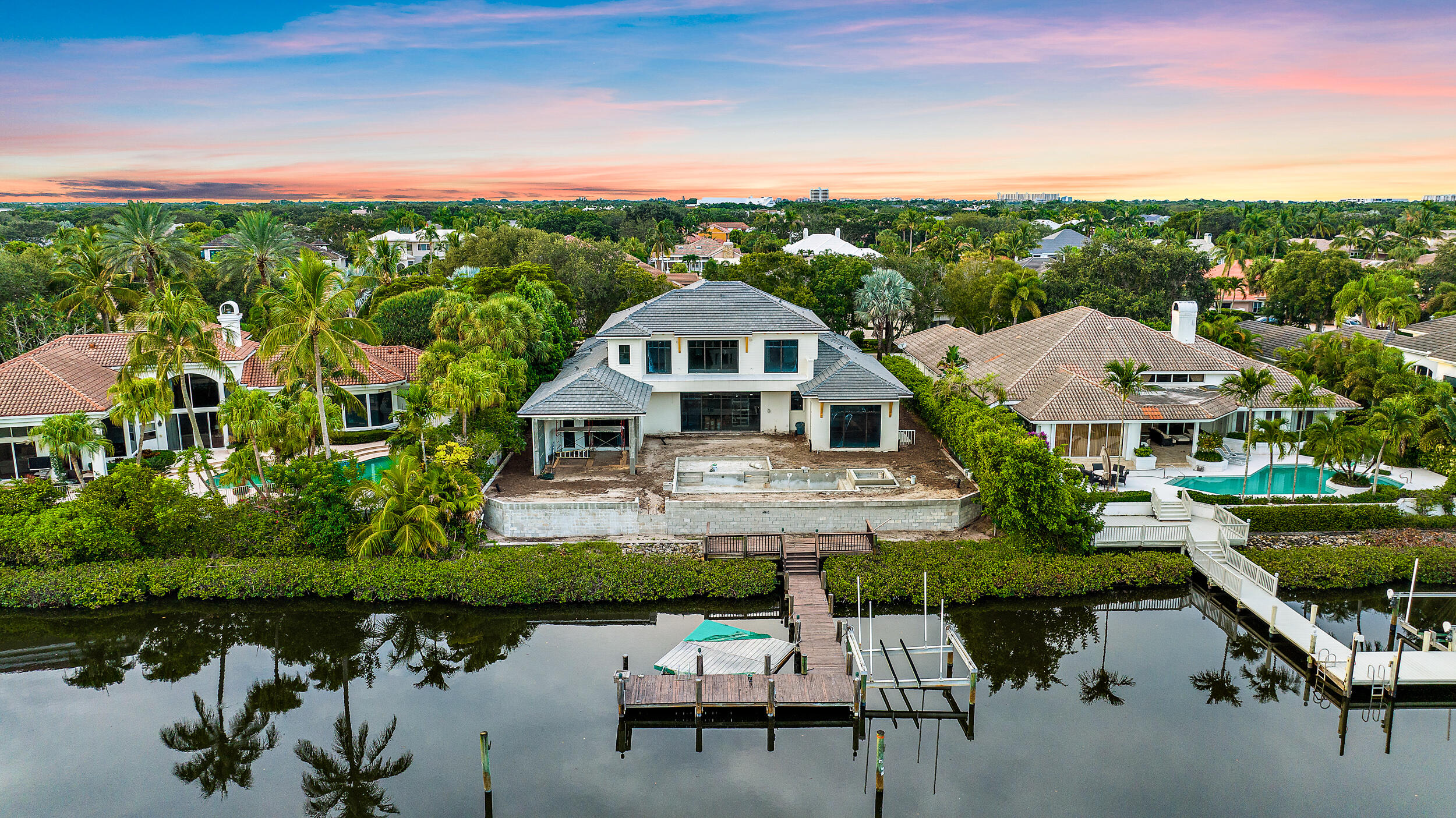 SEASON READY WATERFRONT ESTATE HOME - This waterfront estate home will be ready in 6 short weeks.  5 bedrooms, 6.2 baths with an open kitchen to great room, club room, 2nd floor family/loft area, primary bedroom 1st floor.  Chef's kitchen with custom cabinets and countertops, island food prep station, counter seating, breakfast dining that all over look the resort style pool, loggia, summer kitchen and waterways.  Relax and enjoy countless hours poolside or under the loggia.
Primary Suite boasts 2 full baths, 2 luxurious walk-in closets, Zen sitting area with access to the rear yard and pool.  1 additional guest suite on the 1st floor and 3 more suites on 2nd floor all richly appointed and sized.
Membership will have new pricing November 1, 2023.  Full Golf will be $300,000