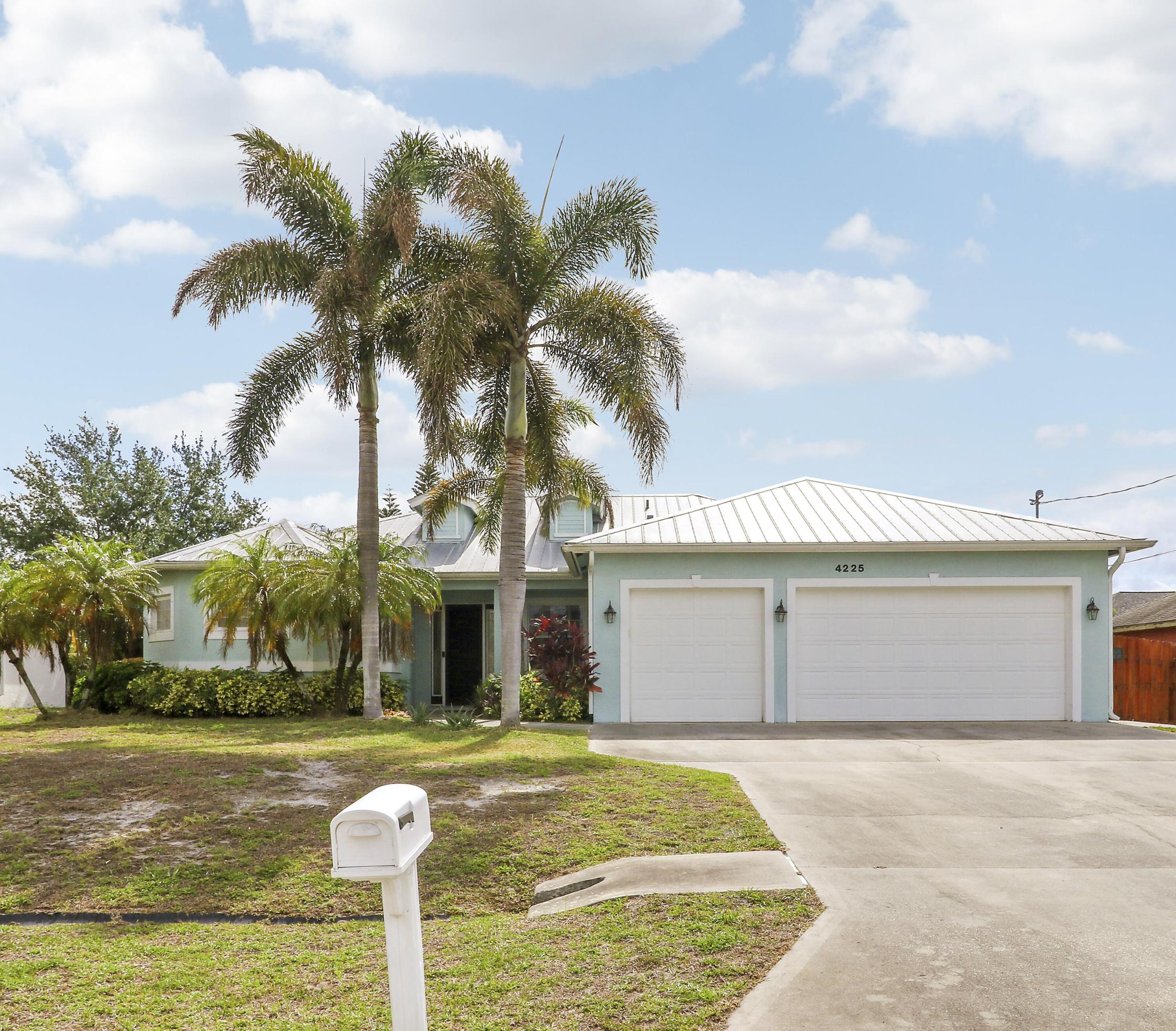 Welcome to 4225 SW Ragen Street — a beautifully updated 4-bedroom, 3-bathroom home designed for comfortable Florida living with no HOA restrictions. This spacious residence features an open-concept floor plan with three separate access points leading to the screened outdoor pool, spa, private shower area, and fully fenced backyard — creating the perfect indoor-outdoor setting for relaxing or entertaining. The expansive primary suite offers a true retreat with dual walk-in closets and a luxurious en-suite bathroom featuring double vanities, a soaking tub, and dual shower heads. Recent upgrades provide peace of mind and modern convenience, including a Generac whole-home standby generator with a 10-year warranty (2025), whole-house PEX repiped (2024), tankless water heater (2024), pool heater (2023), and central A/C system (2022). Additional highlights include elegant tray ceilings, crown molding, ceramic tile throughout the main living areas and bathrooms, luxury vinyl flooring in the bedrooms (2022), and matching palm-leaf ceiling fans installed throughout the home (2024). Additional features include a 250-gallon propane tank and city water with a carbon filtration system. Situated on a quieter street for added privacy, this home remains conveniently located just 5 minutes from I-95 access.  Call today to schedule your private tour!